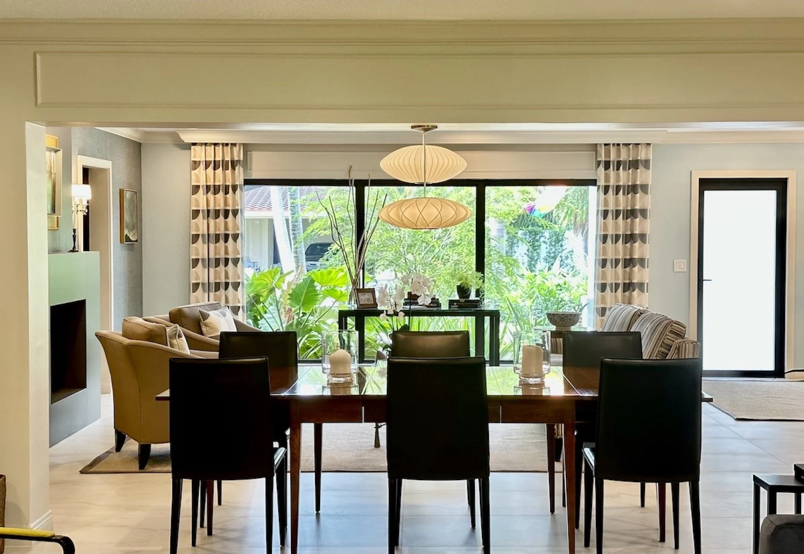 Modern dining room interior design with curated furnishings and statement lighting