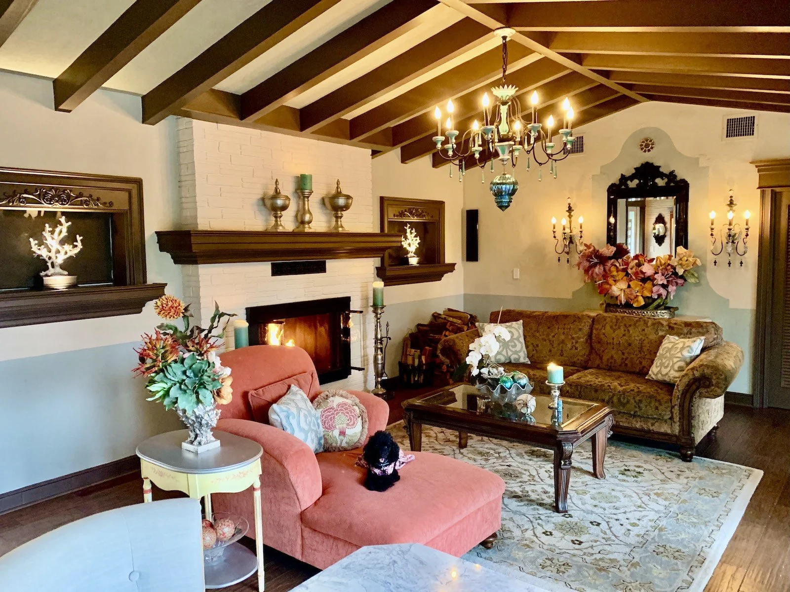 Mediterranean style living room with fireplace, wood beam ceiling, wood molding in Fort Lauderdale