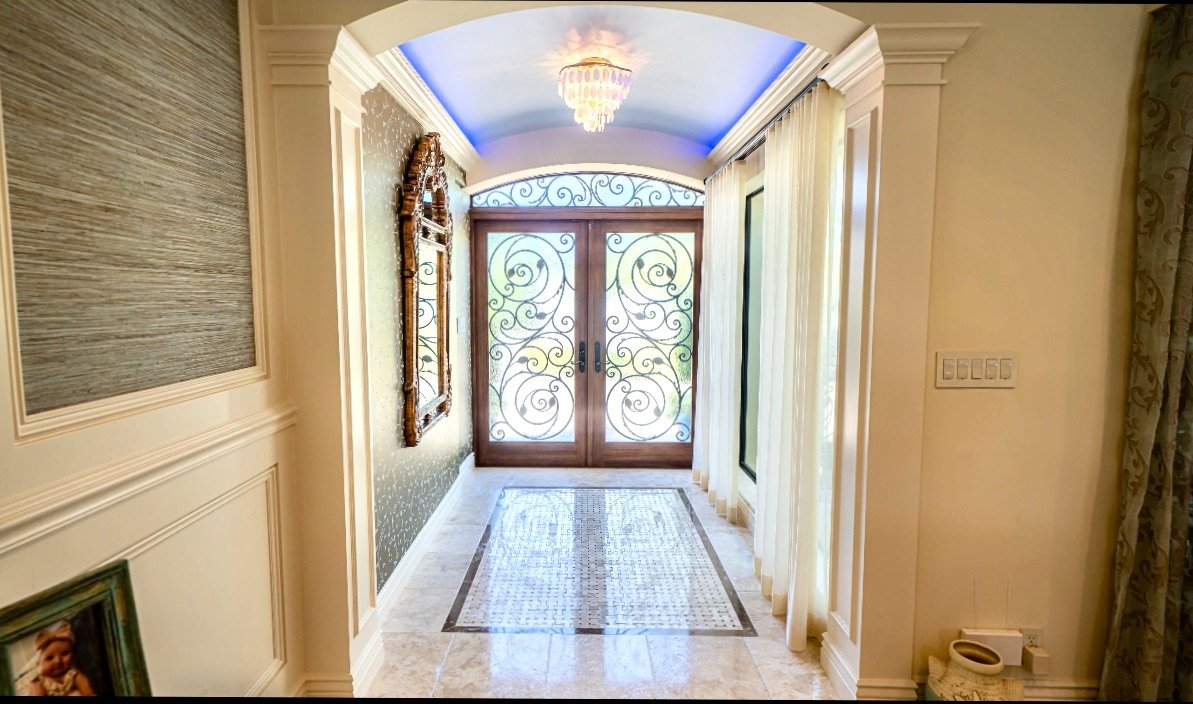 Traditional luxury foyer with vaulted ceiling and LED lights in Fort Lauderdale