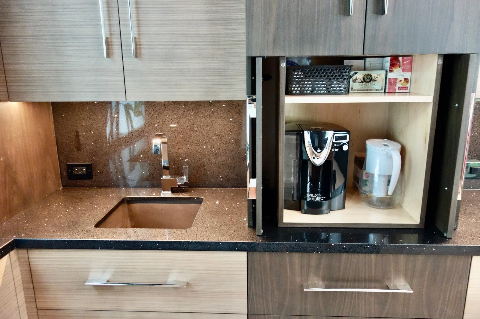 luxury modern home coffee bar with pocket doors and two-tone wood in Fort Lauderdale