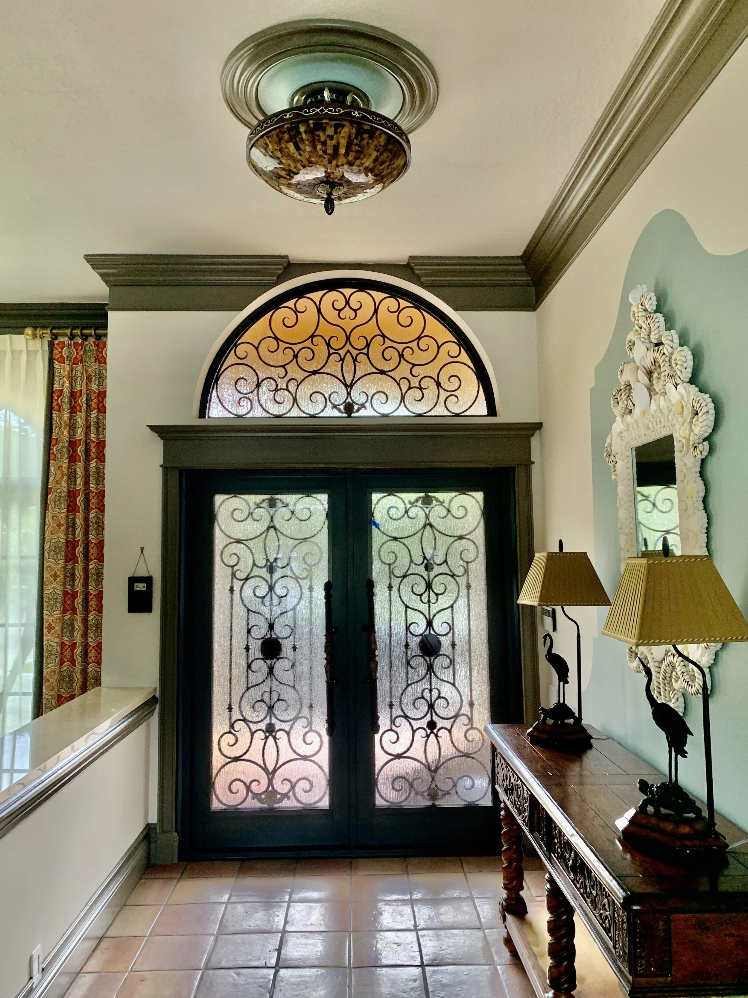 mediterranean home with new wrought iron doors in Boca Raton
