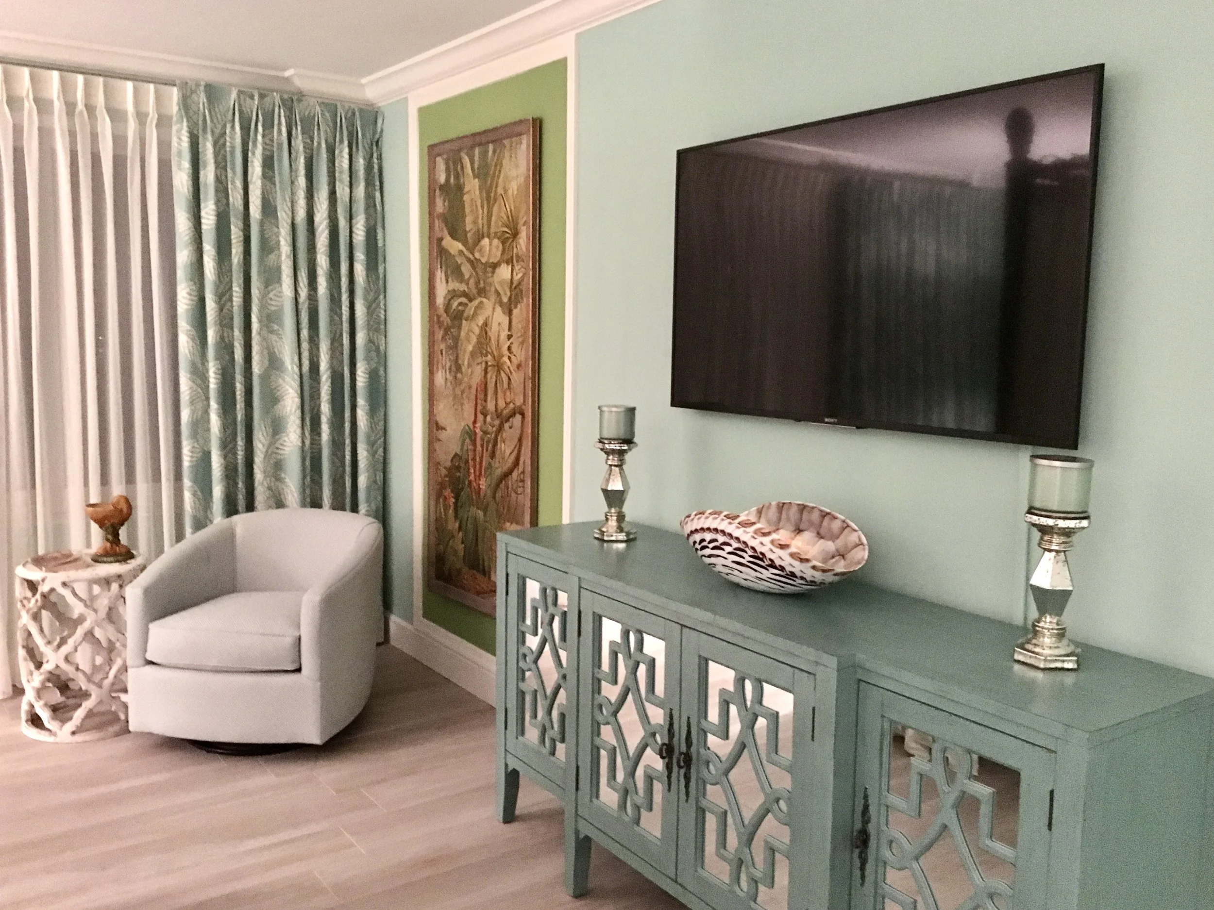 luxury tropical colorful bedroom with seating area in the Florida Keys