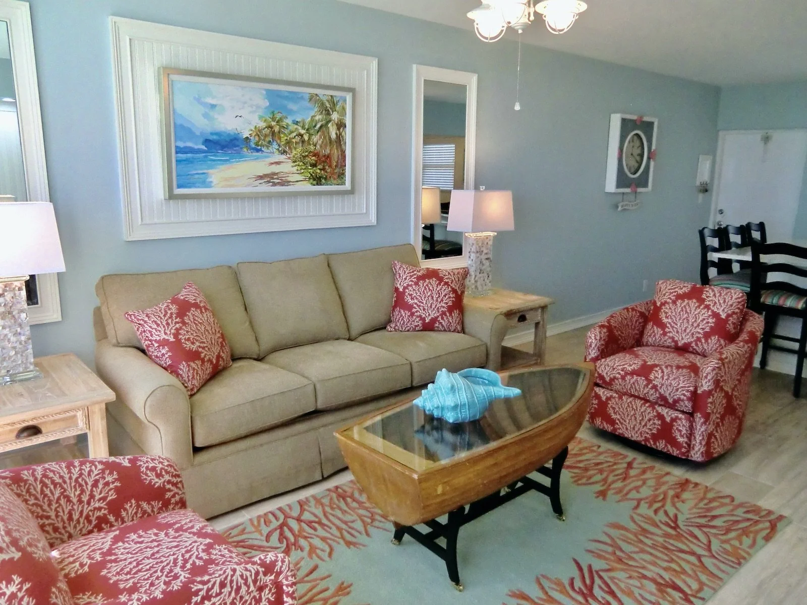 modern tropical  living room with coral and aqua