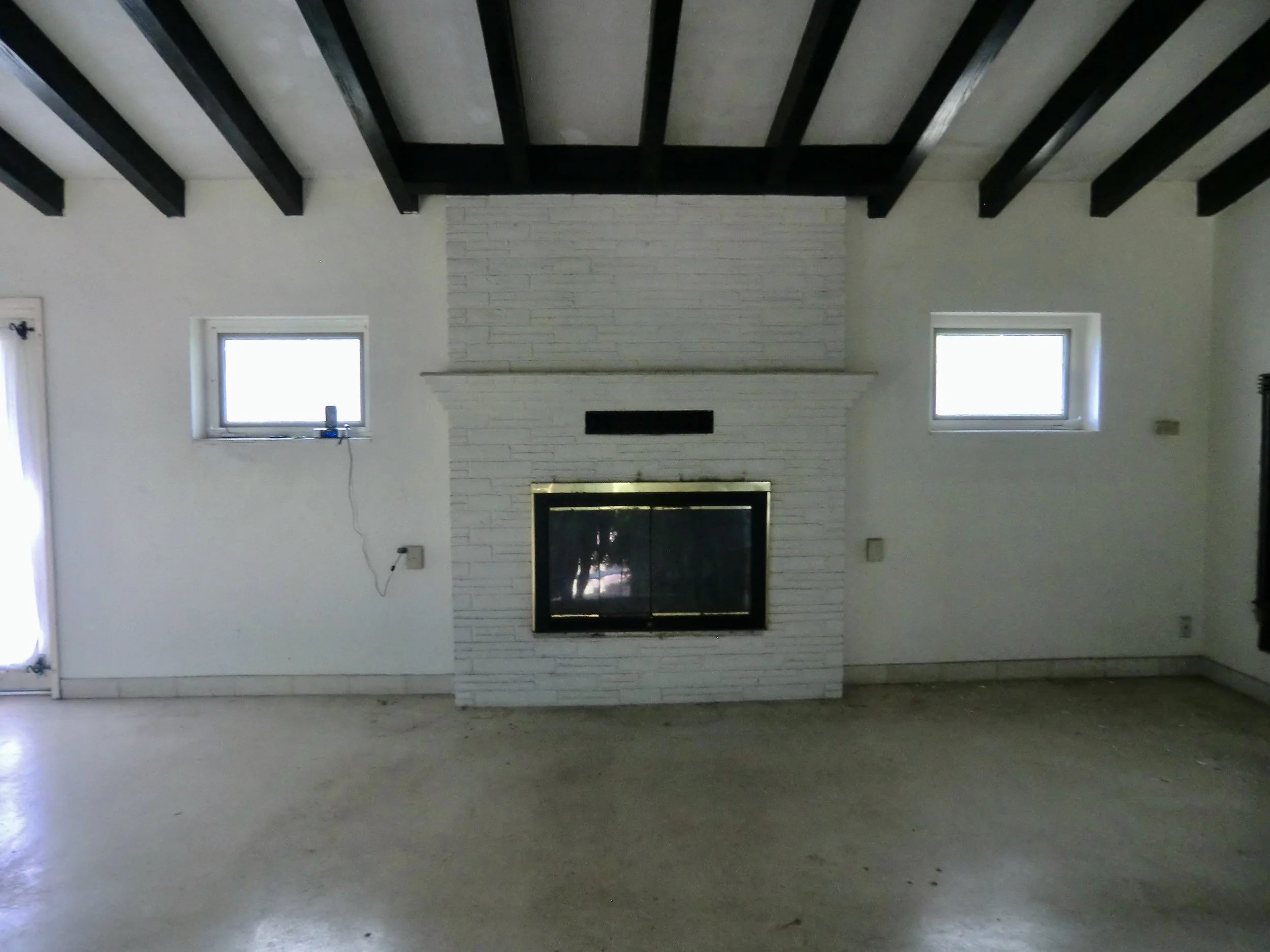 mediterranean style living room before design build remodel in Fort Lauderdale