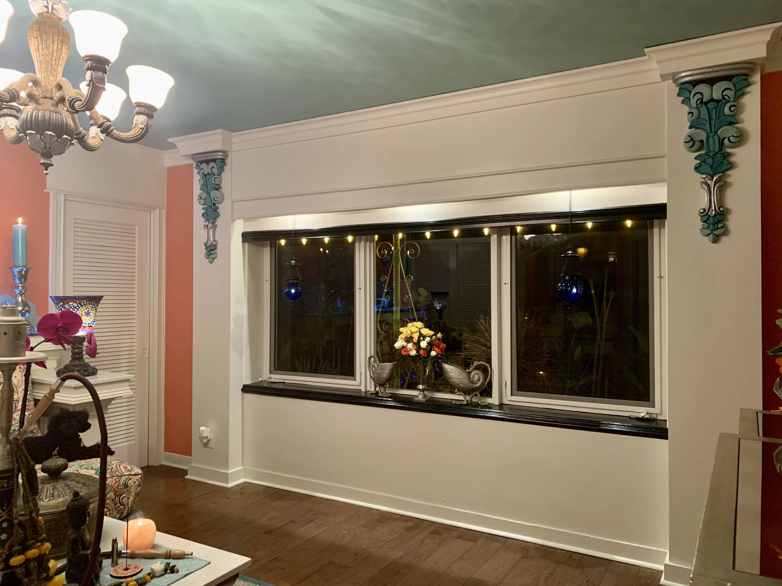 Mediterranean style colorful media room with coral color walls in Fort Lauderdale