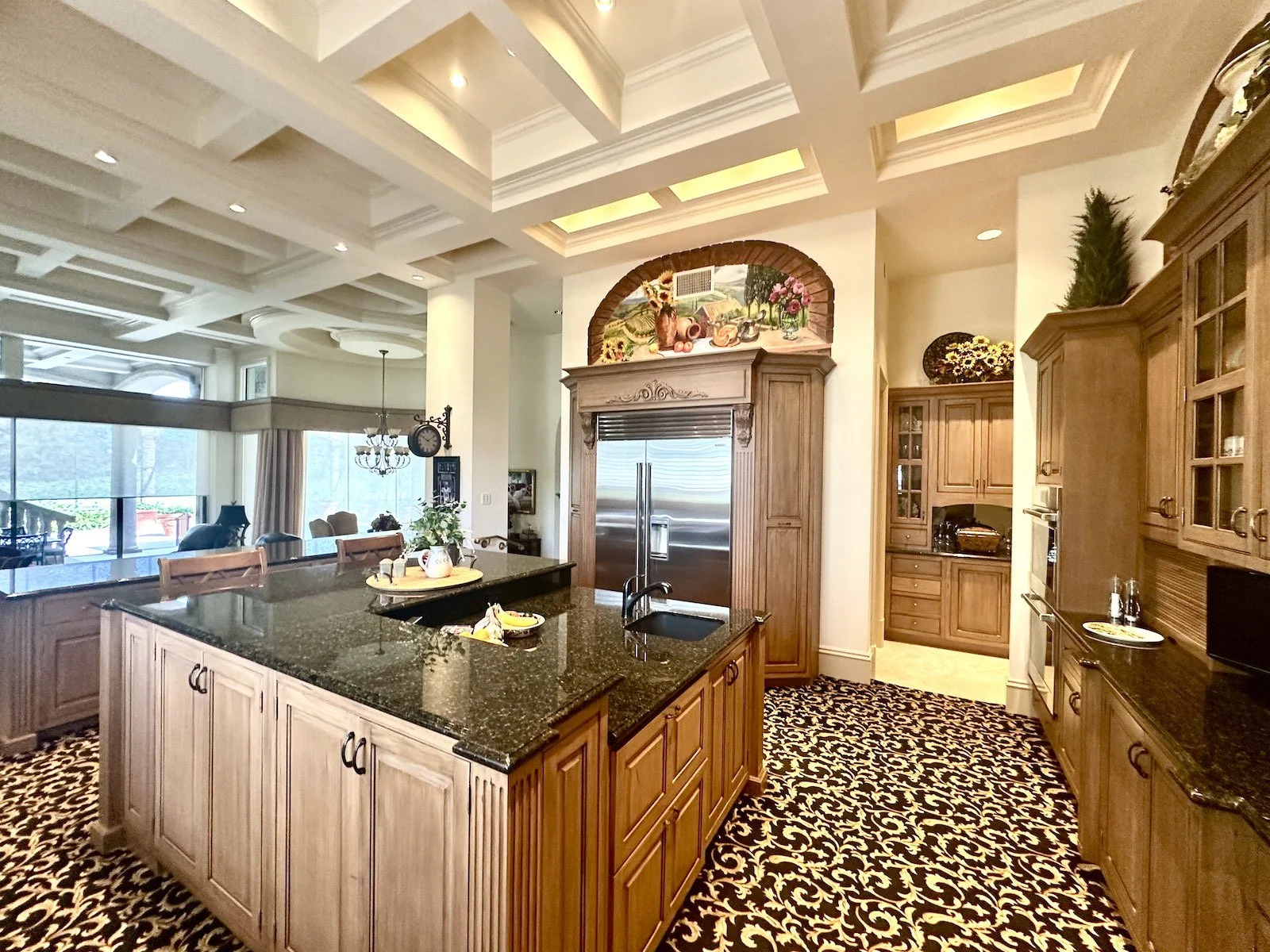 luxury traditional kitchen with panel doors and a coffered ceiling in Jupiter Palm Beach