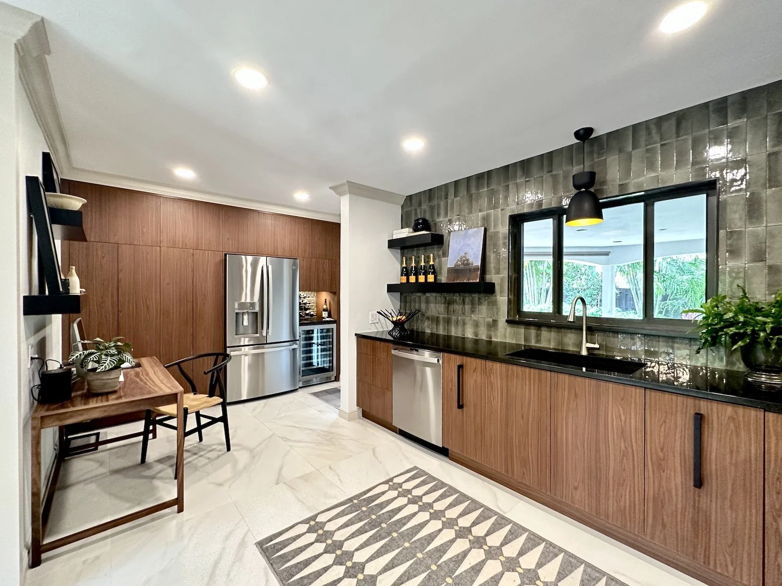 Modern Mid Century Kitchen with custom wood cabinets and floating shelves with built in refrigerator and bar in Fort Lauderdale