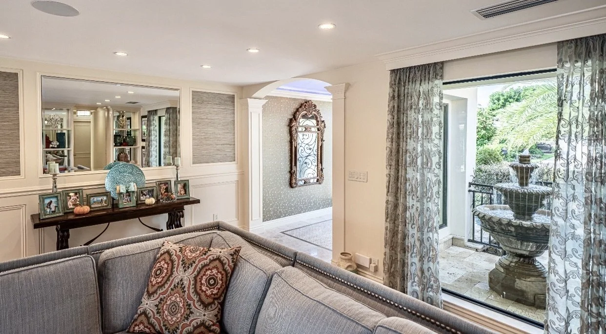 tropical coastal interior design of living room with wainscot in Fort Lauderdale