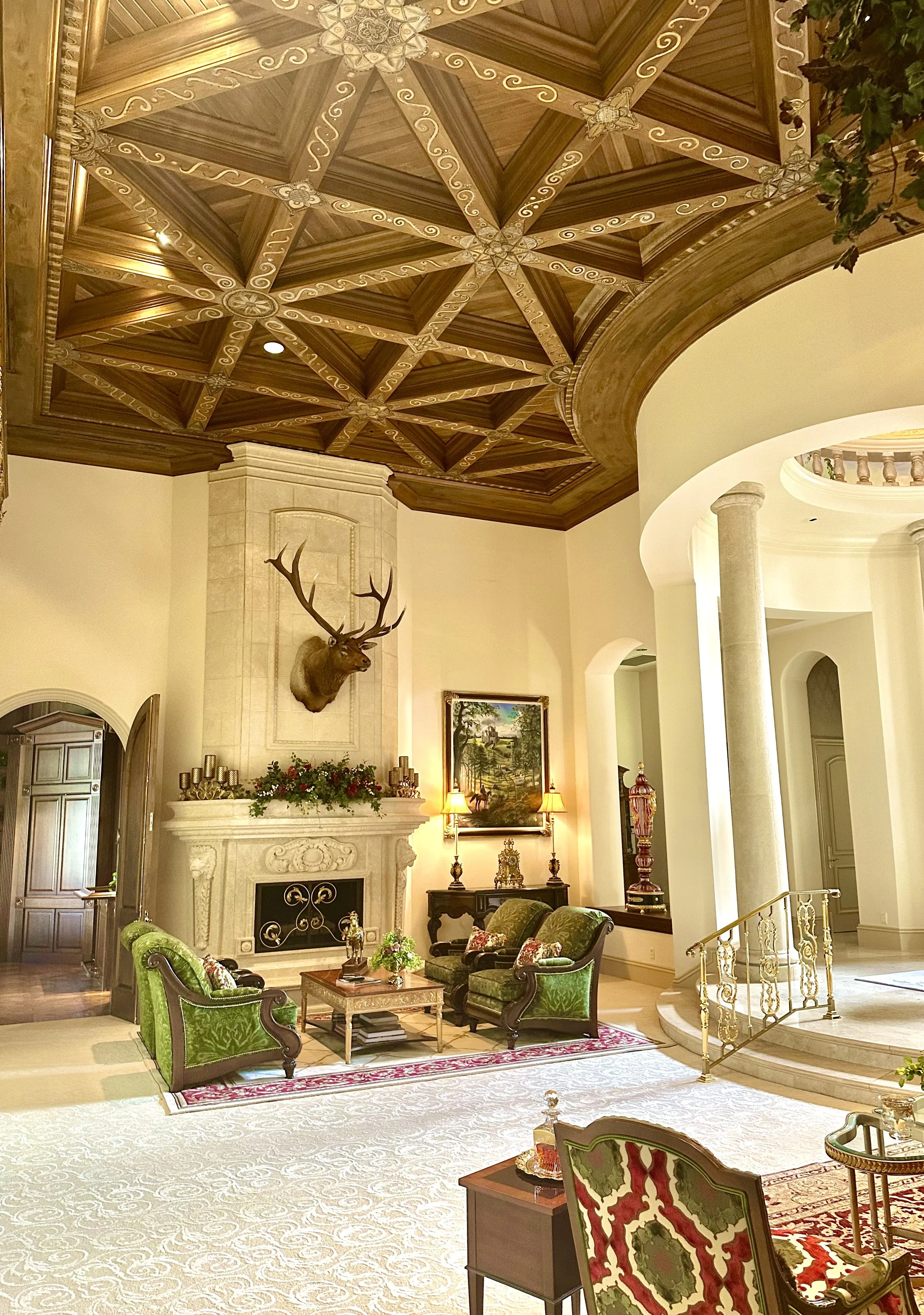 Mediterranean living room with fire place with coffered ceiling