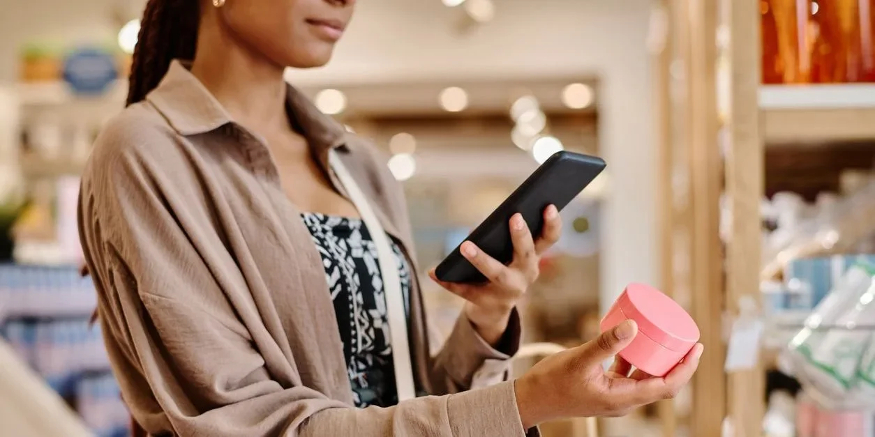 A woman scanning a product with her smart phone to access the Digital Product Passport information