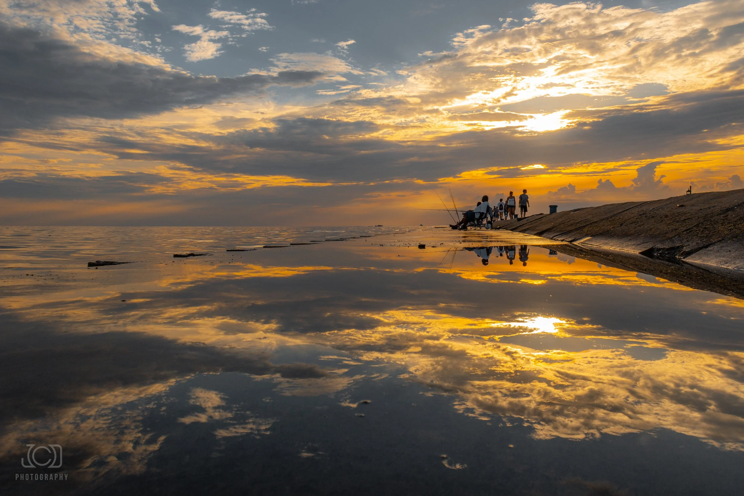 Fishers reflection at St Jo pier wm.jpg