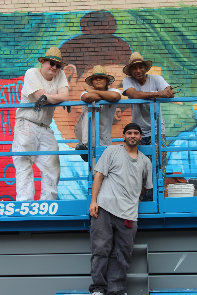 BB4's Rafael Planten (bottom row) got elevated to help paint "Pride." 