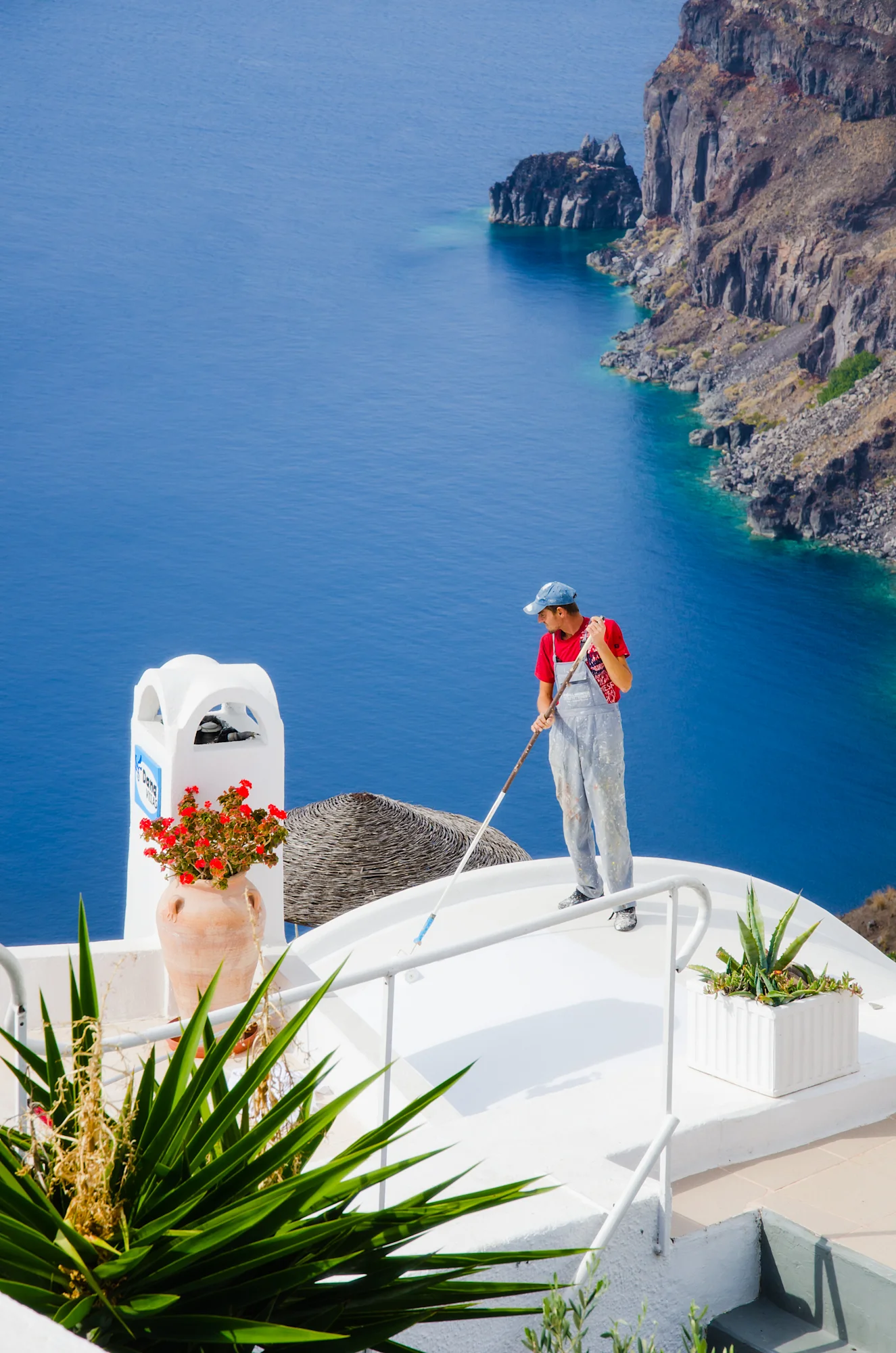 Kelly Sandos Santorini rooftop painter