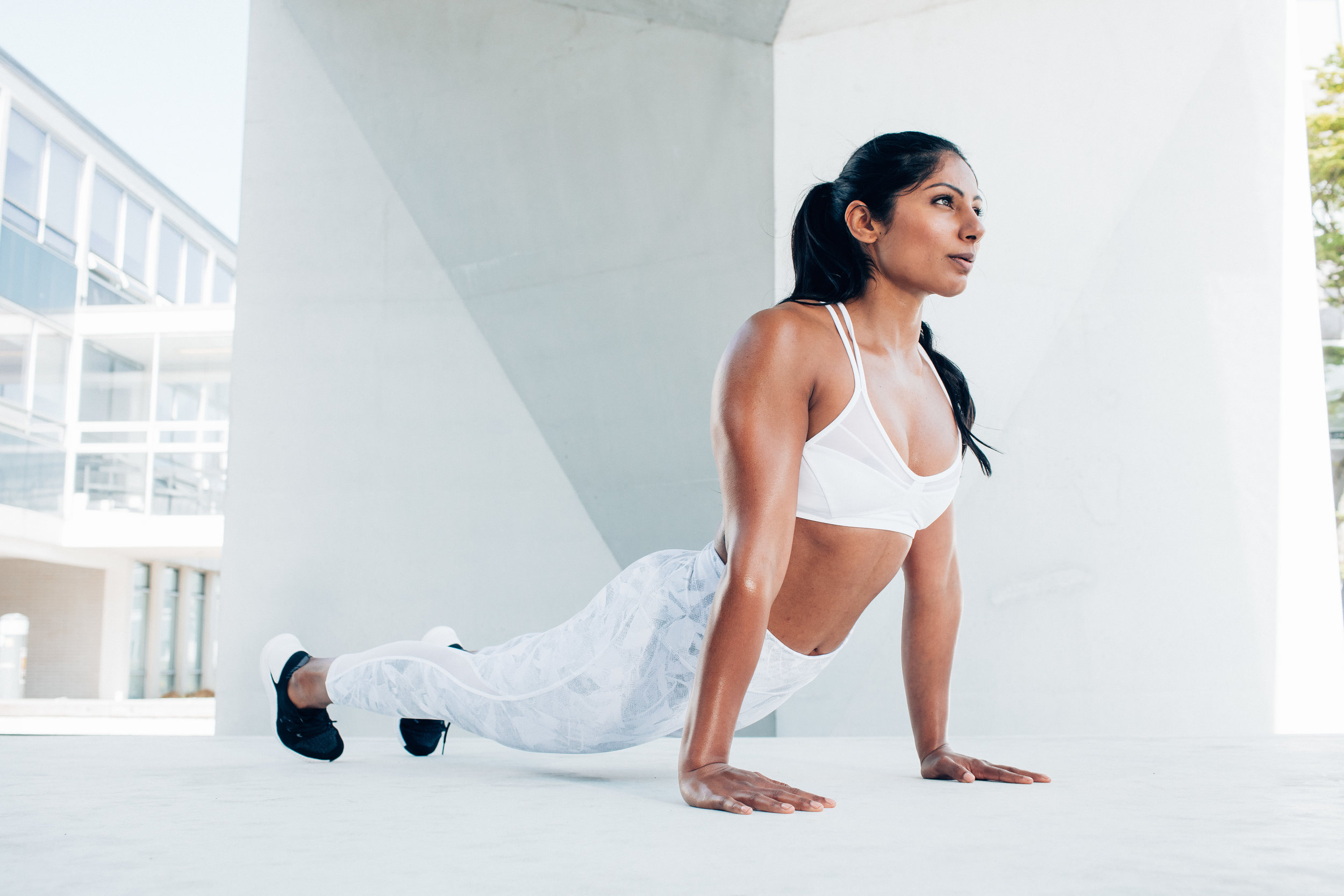 Model Pallavi Gurrala stretching on a fitness photoshoot with photographer Anick Violette.