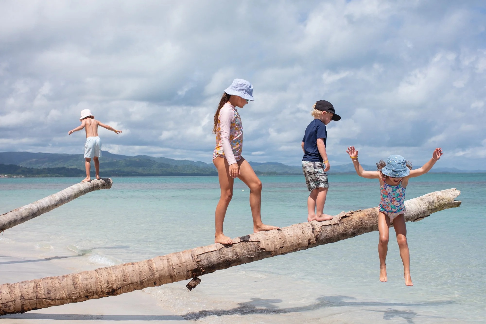 Travel lifestyle images of kids playing on the beach