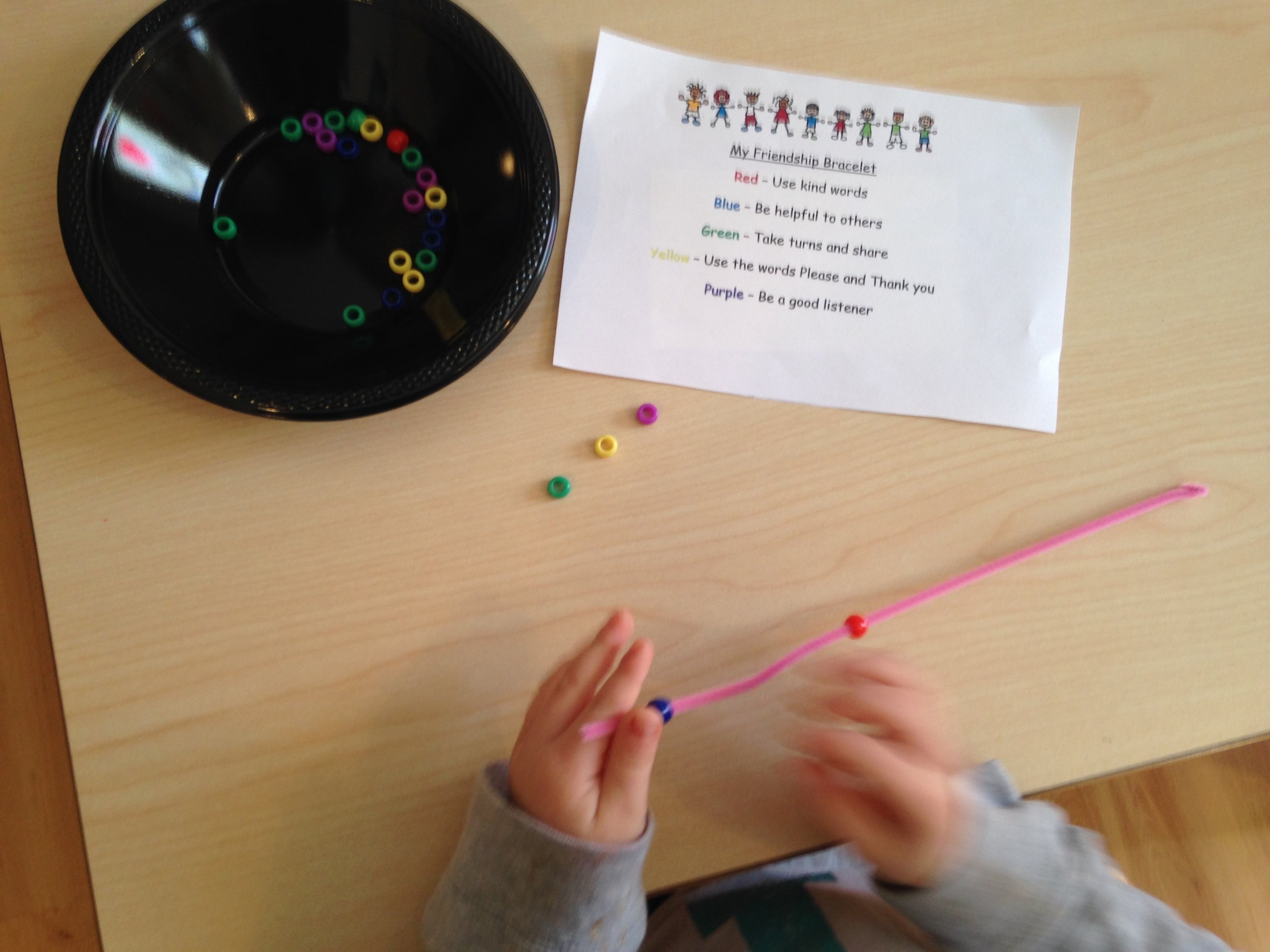 Creating a friendship bracelet to help us remember our friendship rules 