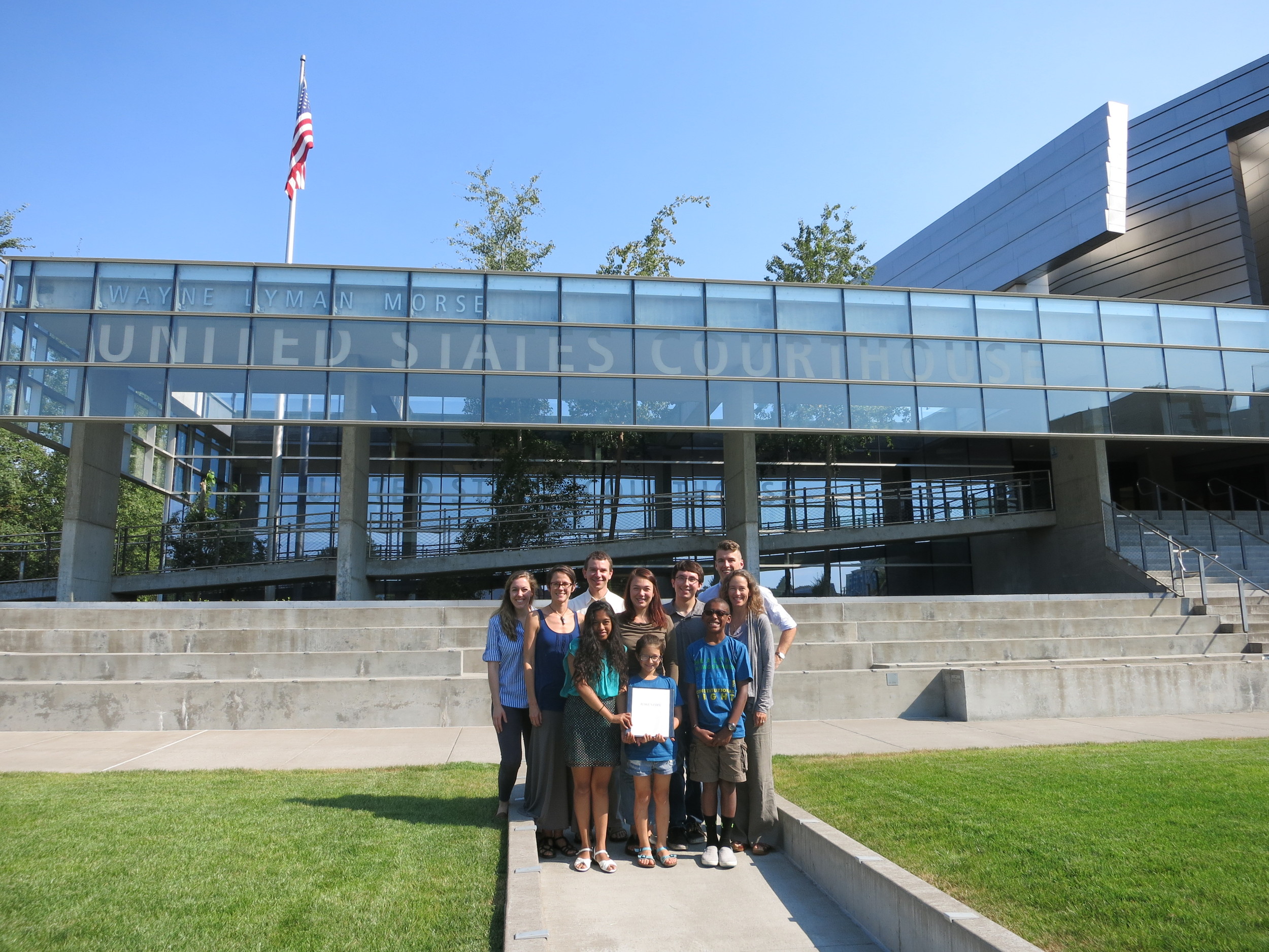 Some of the plaintiffs and OCT staff and law clerks outside the Wayne Morse United States Courthouse in Eugene, OR on August 12, just before submitting the federal complaint.