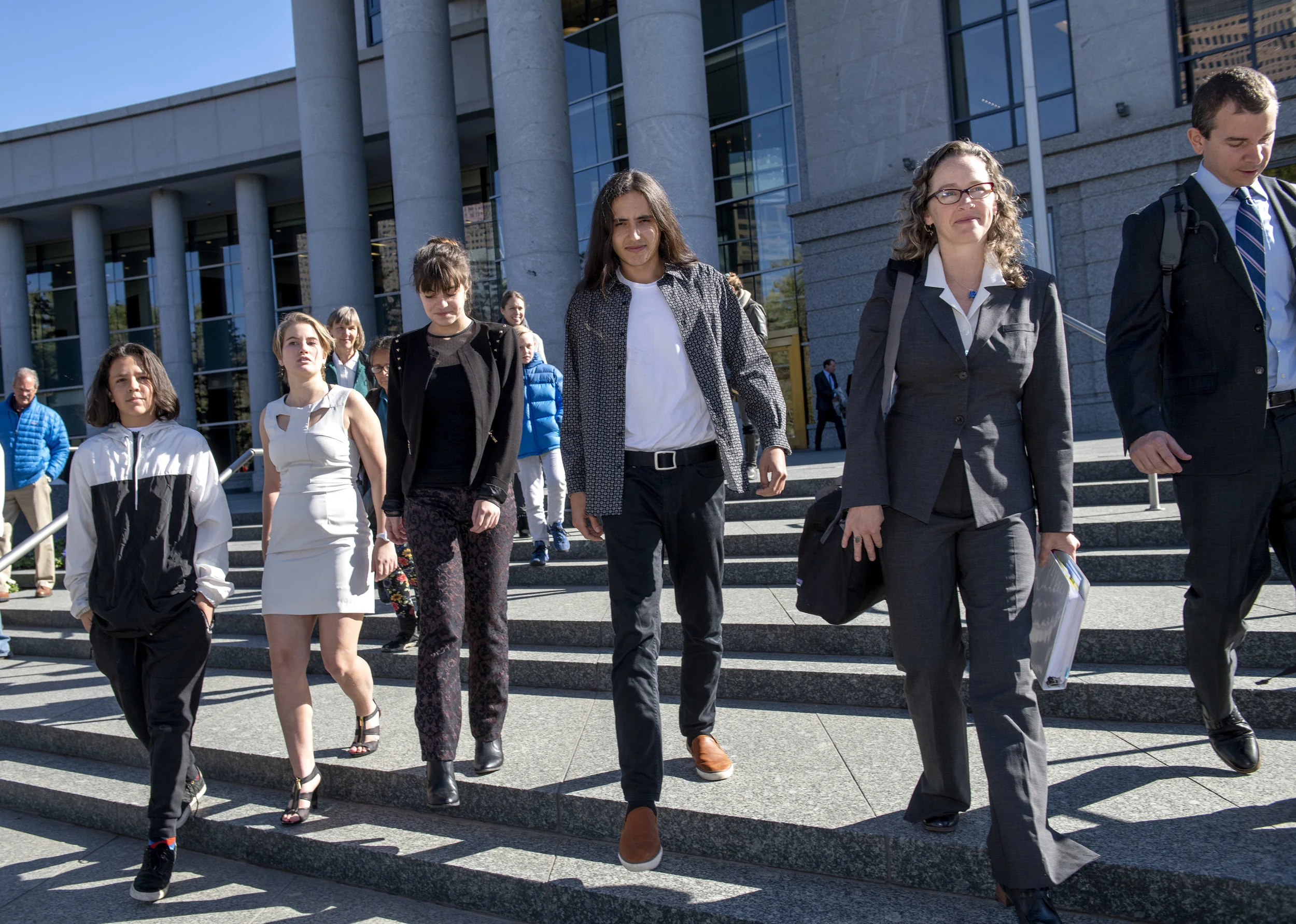 From left, youth plaintiffs Itzcuauhtli, Emma, Aerielle, and Xiuhtezcatl leave the Colorado Supreme Court with their attorneys Julia Olson and Nate Bellinger after oral argument in their climate lawsuit against the Colorado Oil and Gas Conservation Commission on October 16, 2018 in Denver, CO.