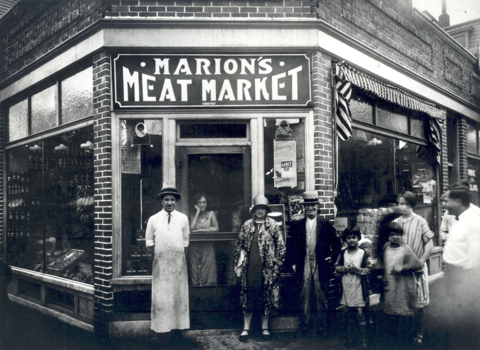 Marion’s Meat Market, Little Canada neighborhood, Lowell, around 1926. Wilfrid Marion, grandfather of PM, is in the long white butcher’s apron in front. The other persons are unidentified.