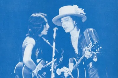 Joan Baez & Bob Dylan singing at Costello Gym in Lowell, Nov. 2, ‘75. Photo courtesy of UMass Lowell.