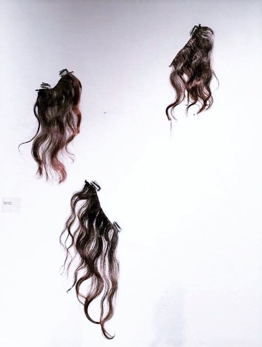 3 handmade clip-in extensions made from the artist's hair for the performance.