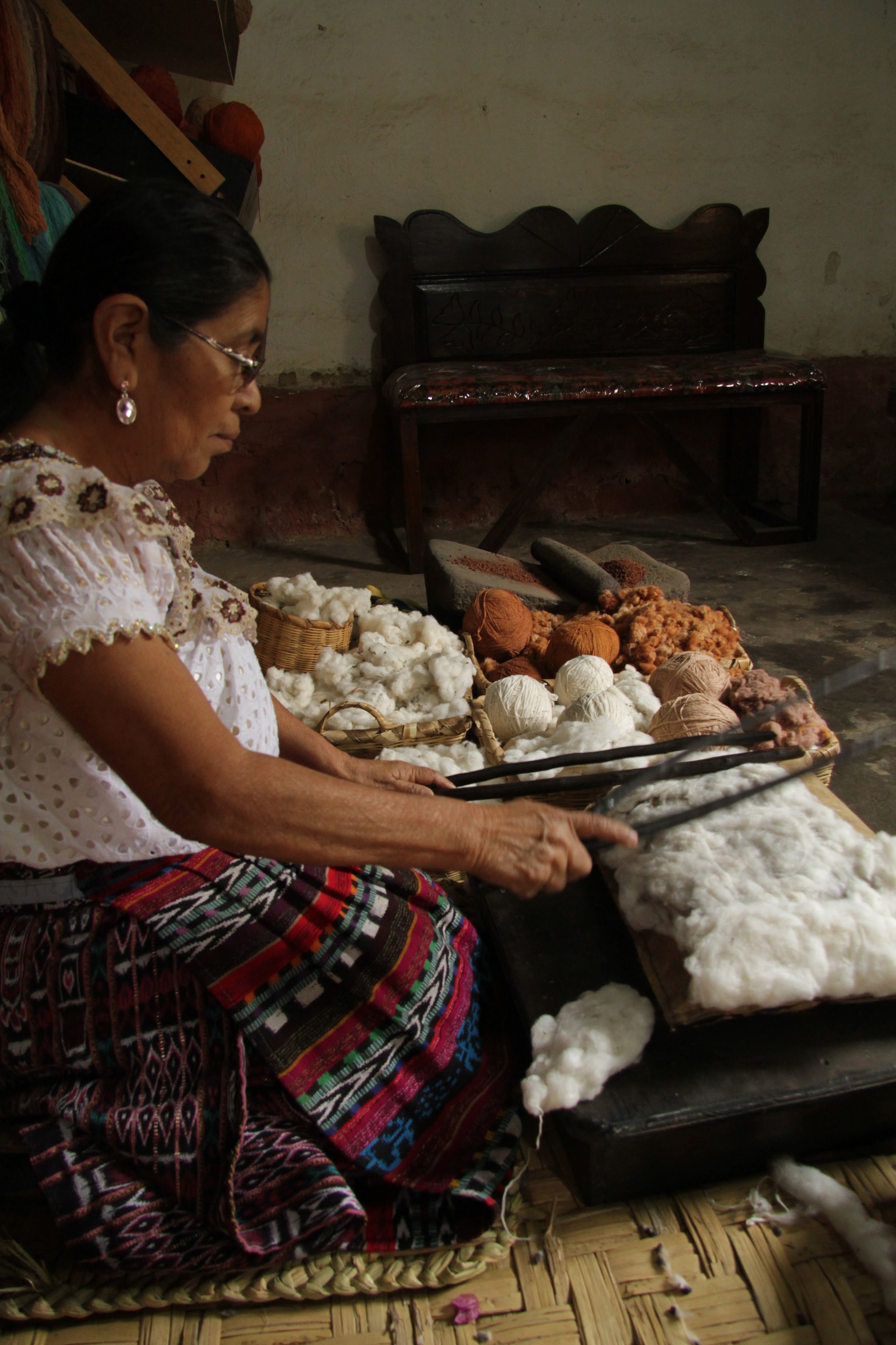 It takes 20 minutes to beat the cotton until it is soft and smooth and ready for spooling.