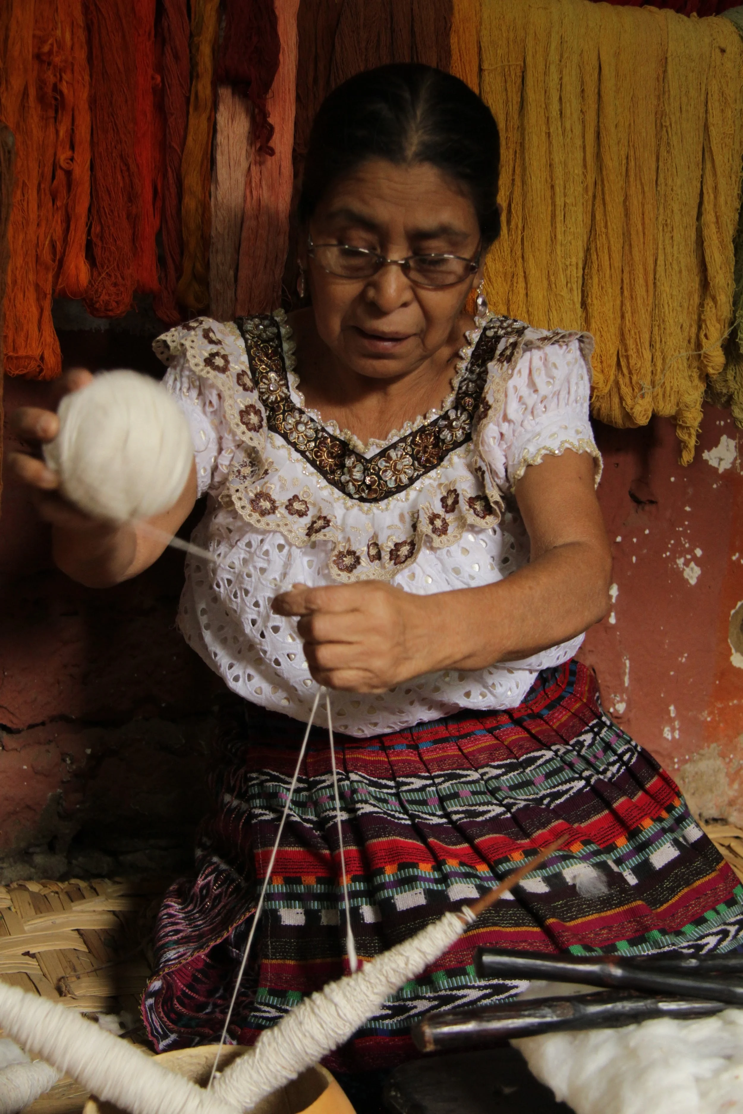 Once the cotton is spooled, they create the ball of yarn. &nbsp;It takes about 4 hours to roll two spools into one ball of yarn.