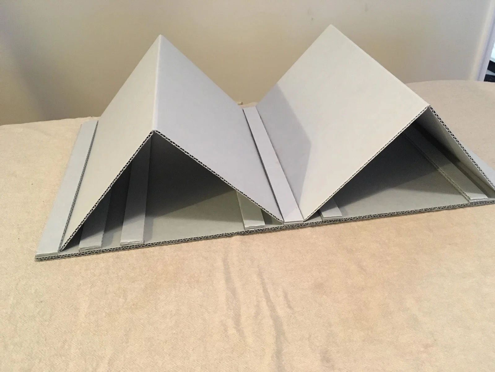Image of a collapsable book cradle assembled.