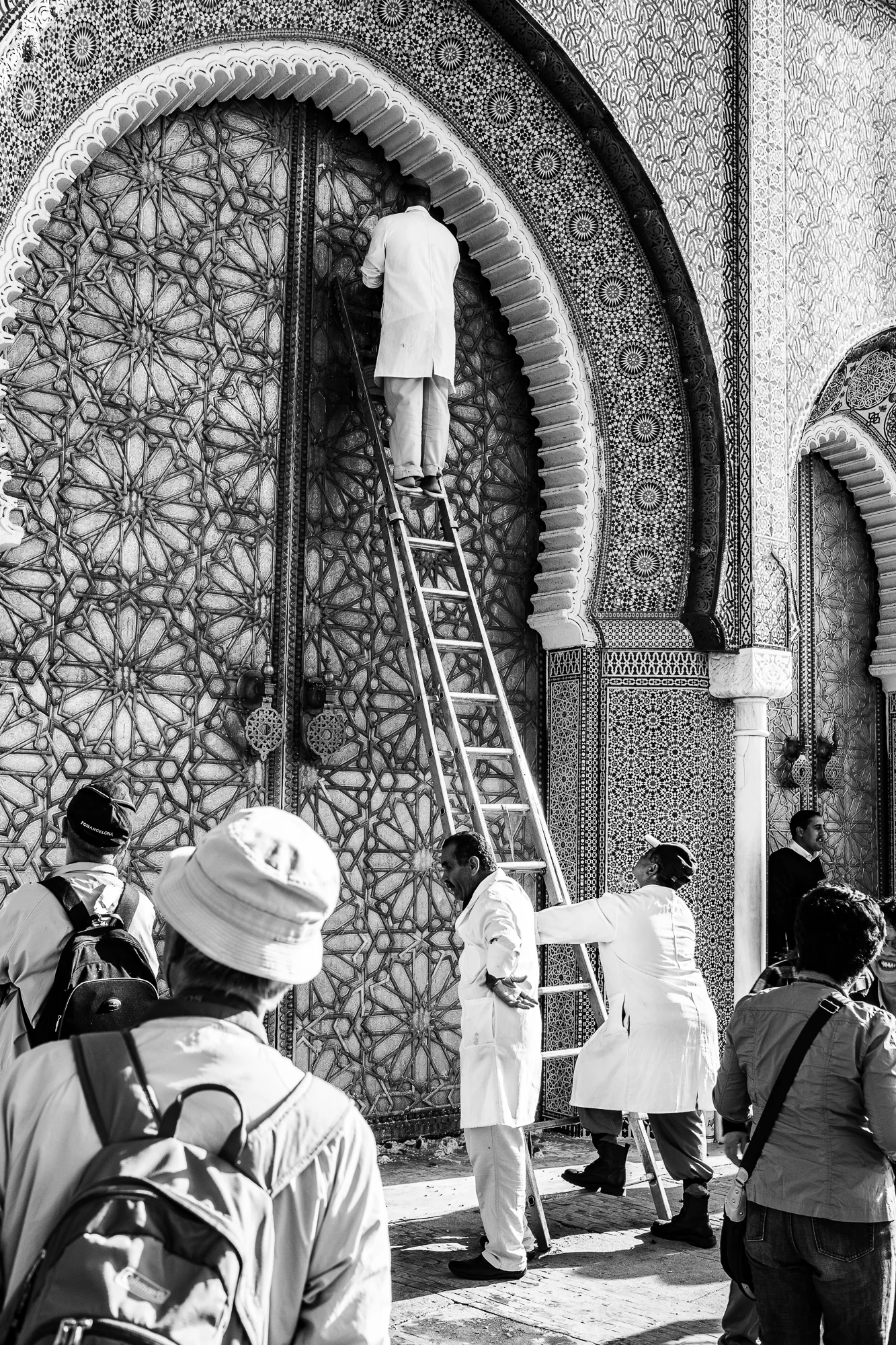 It takes a village to keep the palace doors shining.