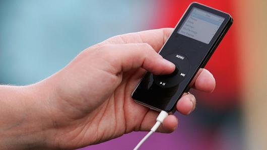 Getty Images In this photo illustration a woman listens to an Apple iPod Nano on October 2, 2006 in London, England.