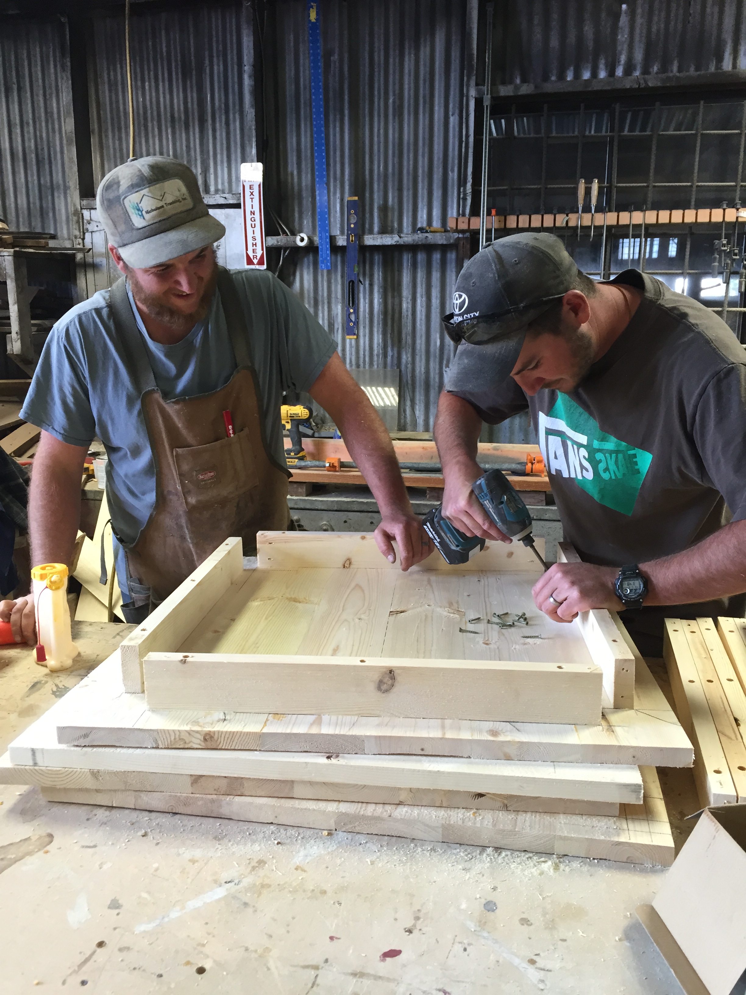 JEREMIAH AND JOSIAH SIMPSON WORKING ON A CUSTOM TABLE ORDER