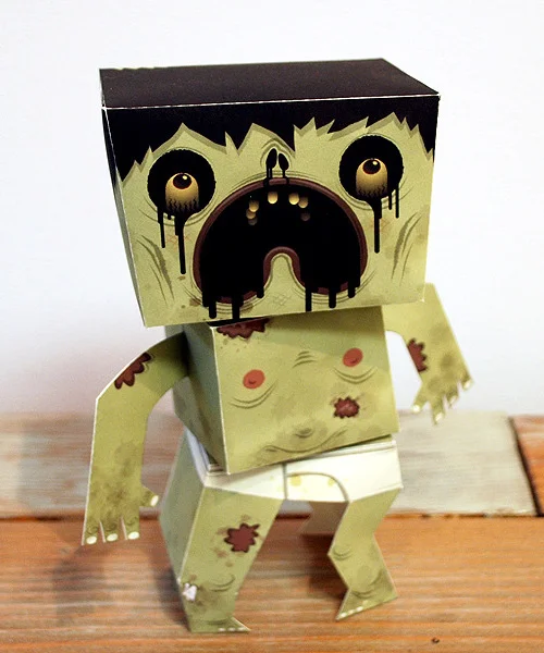 Exquisite Corpse opened last night at Light Grey Art Lab . 52 adorable paper-craft zombies for all the world to cower in fear at.