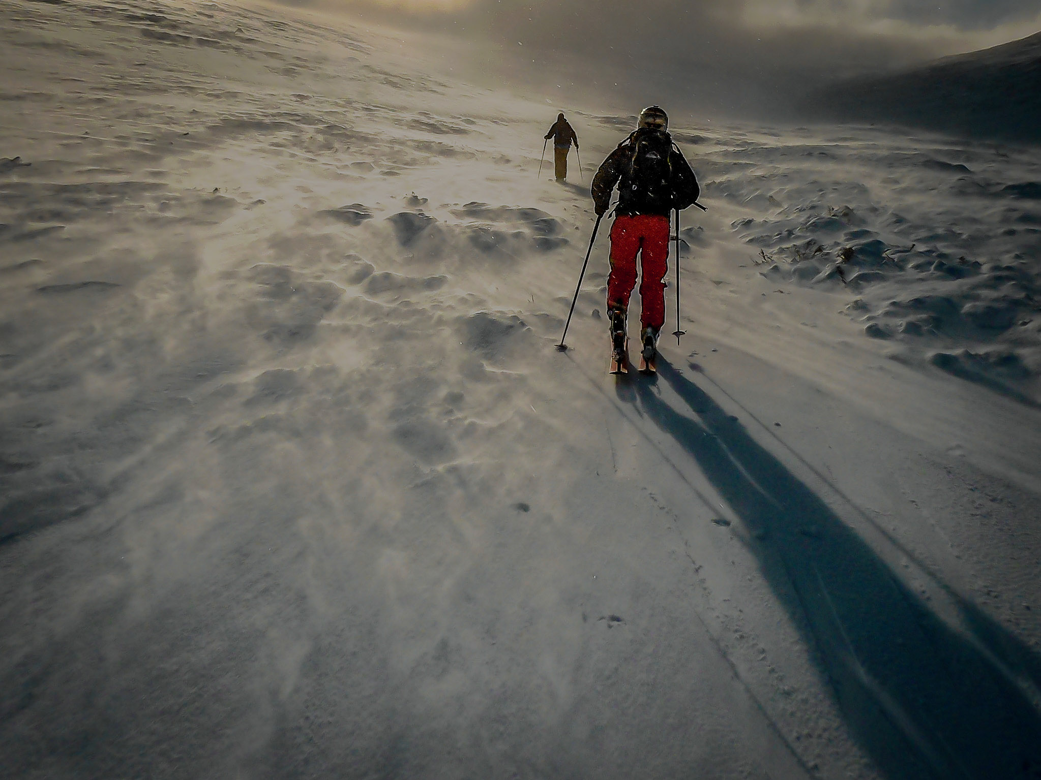 Skinning up Lurcher's Gully. The spindrift racing past makes the mountain feel like it has turned into a raging river.