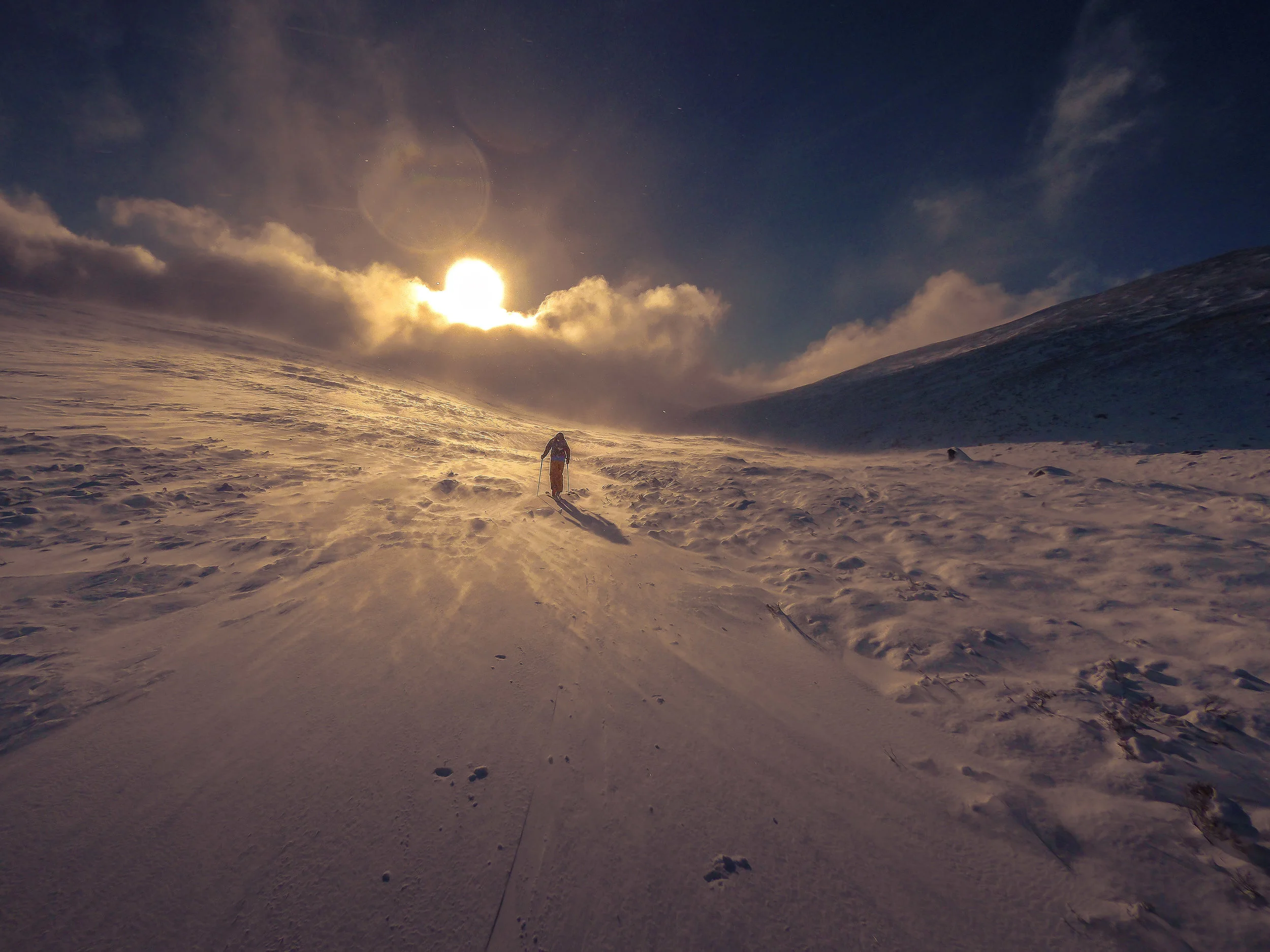 Beautiful light and blowing snow making the mountains feel otherworldly