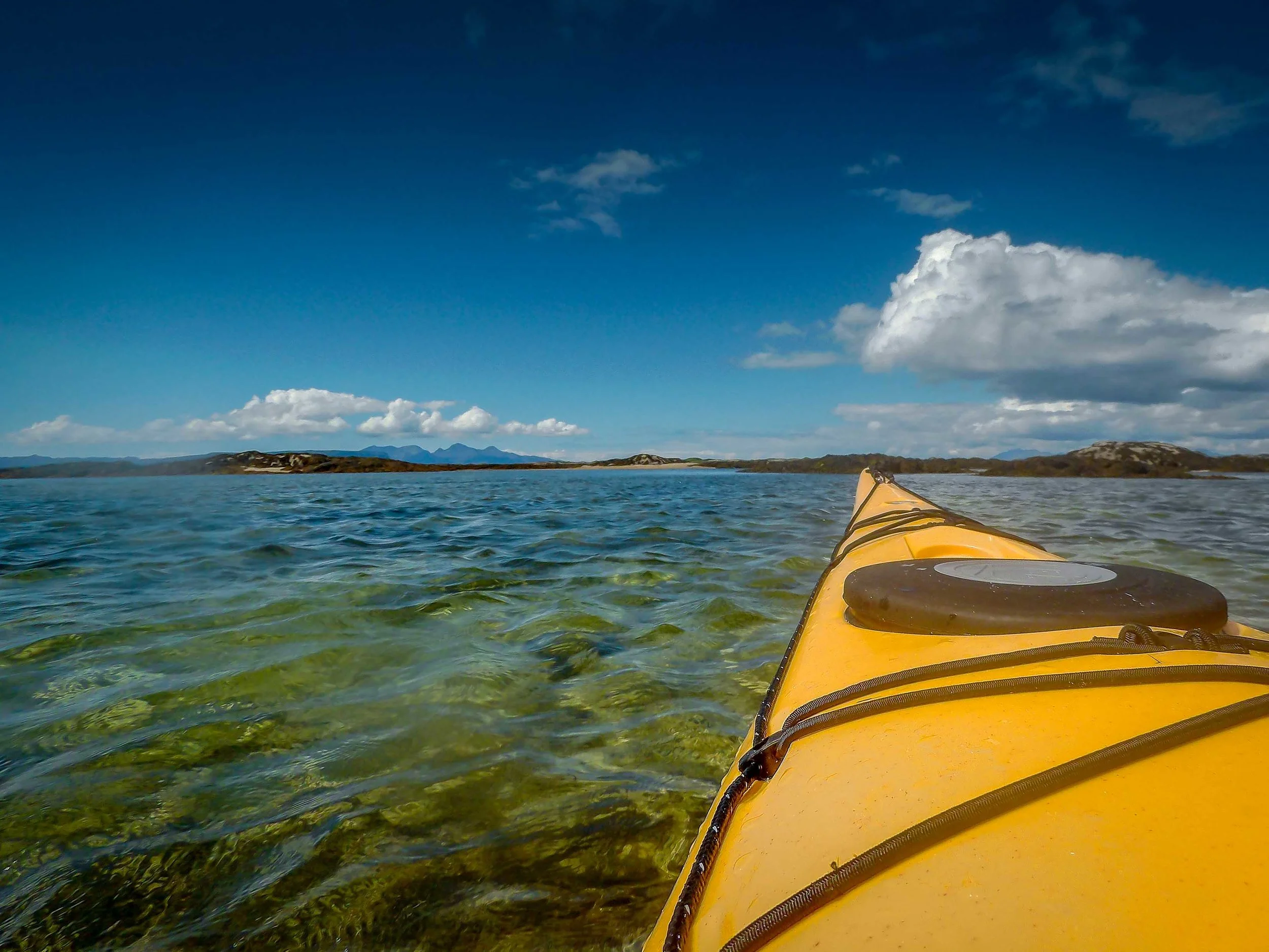 Clear blue water and blue sky, not a bad combination. Rum is in the distance, beyond the skerries.