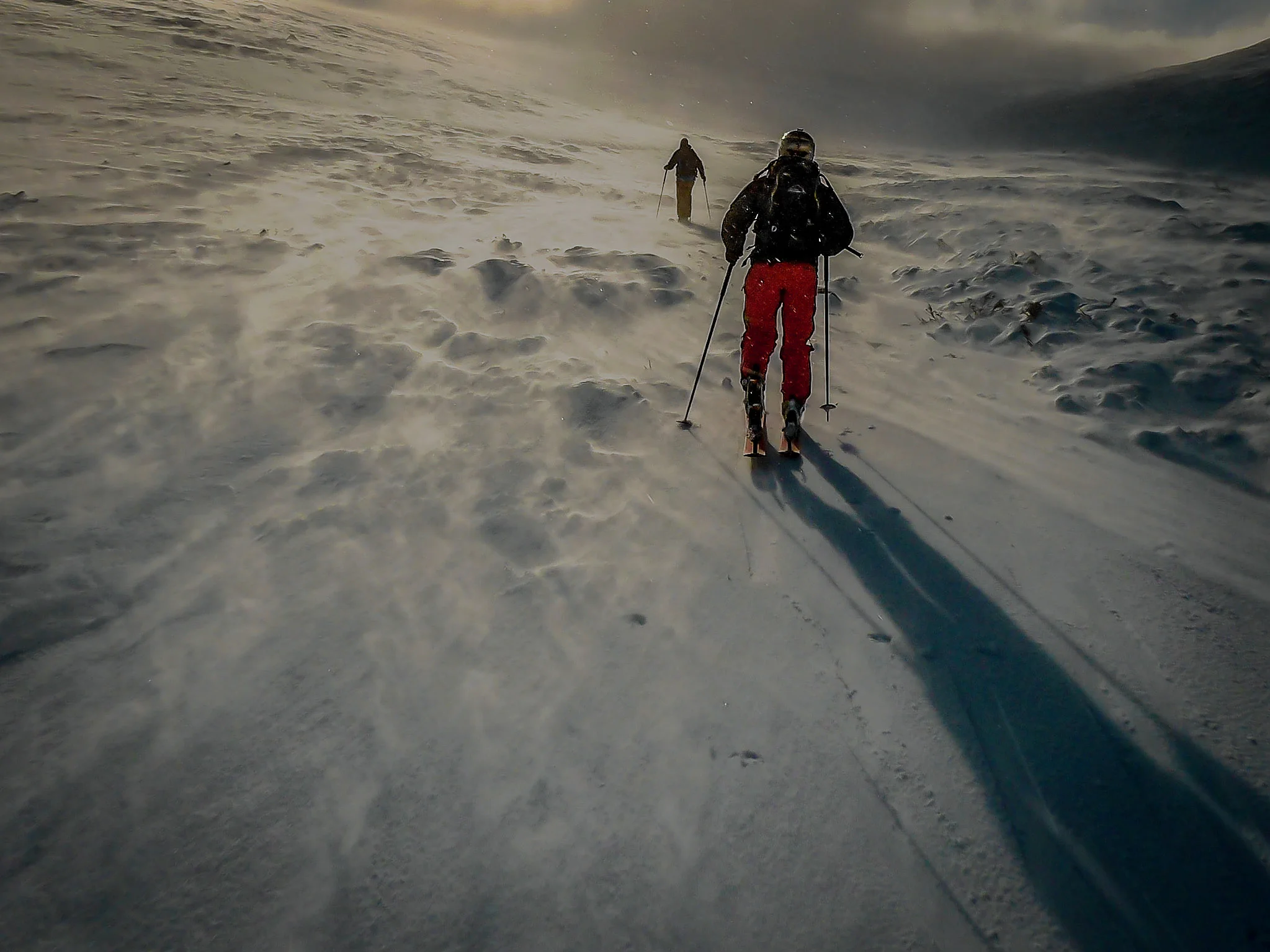 Skinning up Lurcher's Gully. The spindrift racing past makes the mountain feel like it has turned into a raging river.
