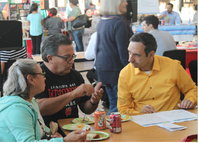 Alianzas Director, Gerardo Martinez, talks with attendees of the Branson Binational Health Fair. Photo credit: Alianzas