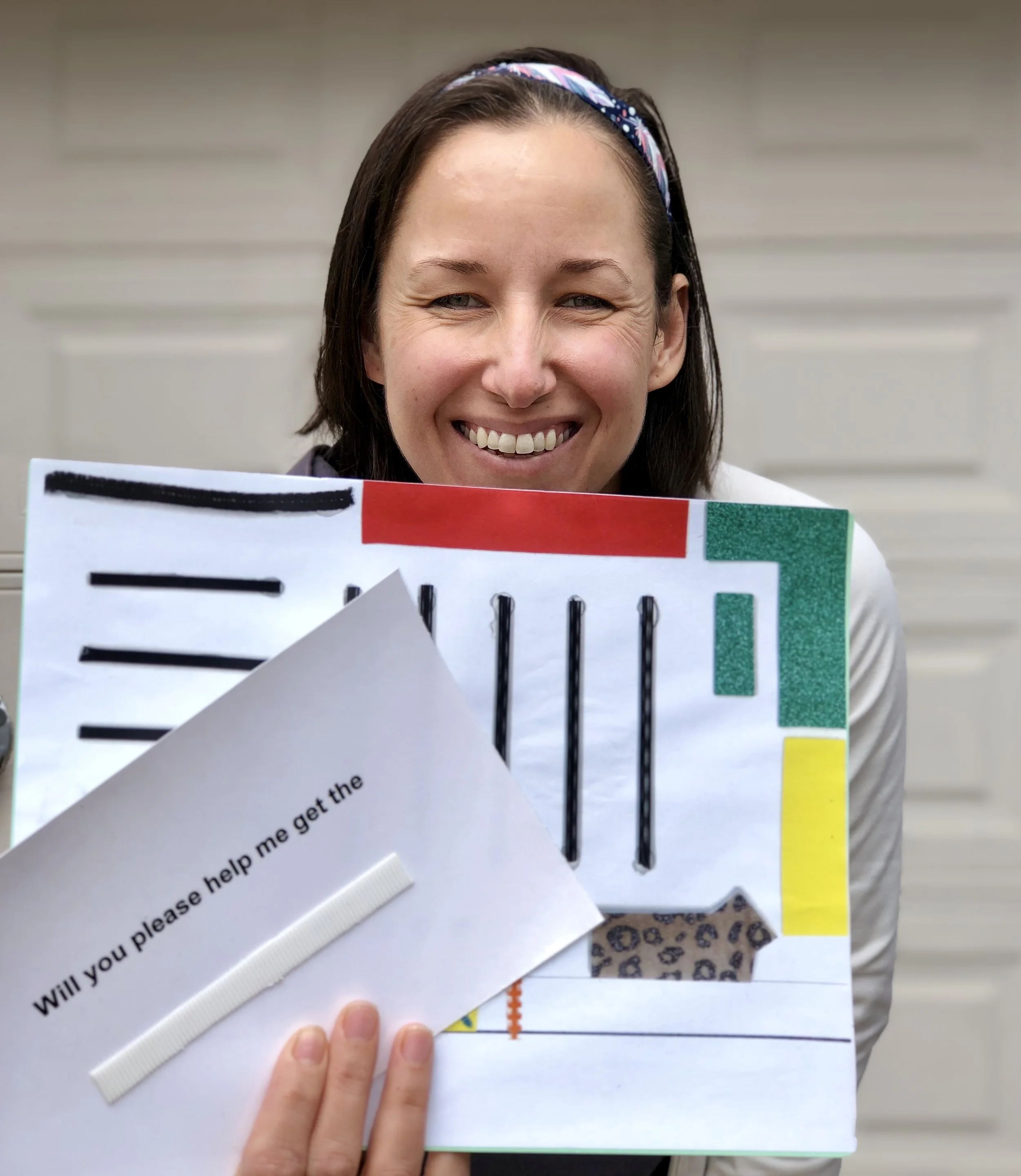 Kassy holding a map of a grocery store and a card that says “will you please help me find"_______.