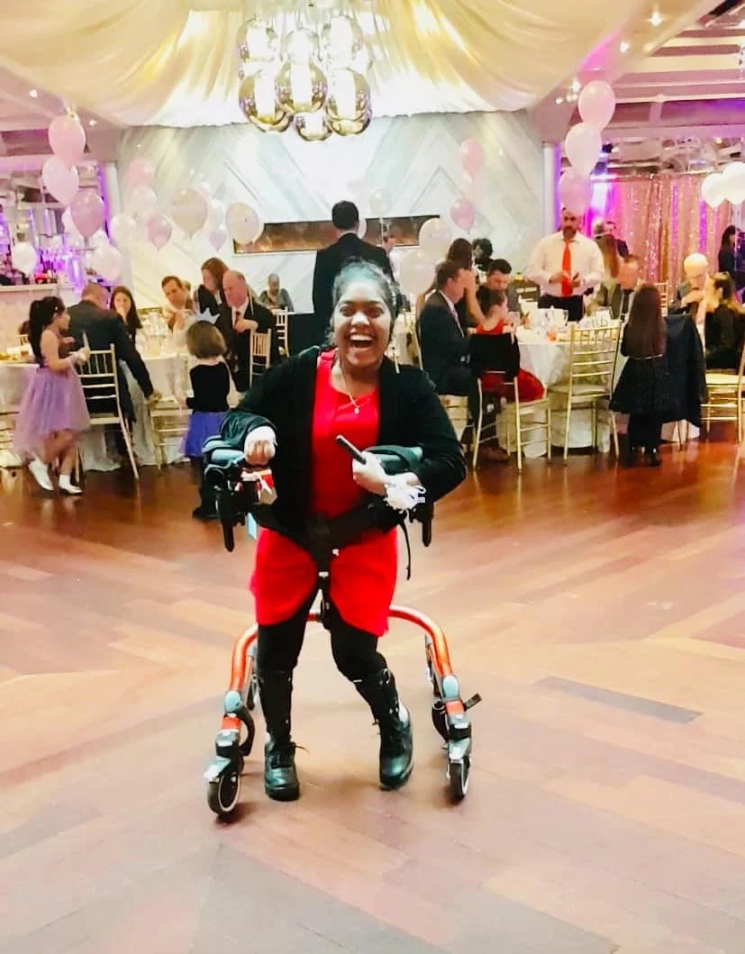 Jessica dancing in a Rifton Pacer at a Father/Daughter Dance
