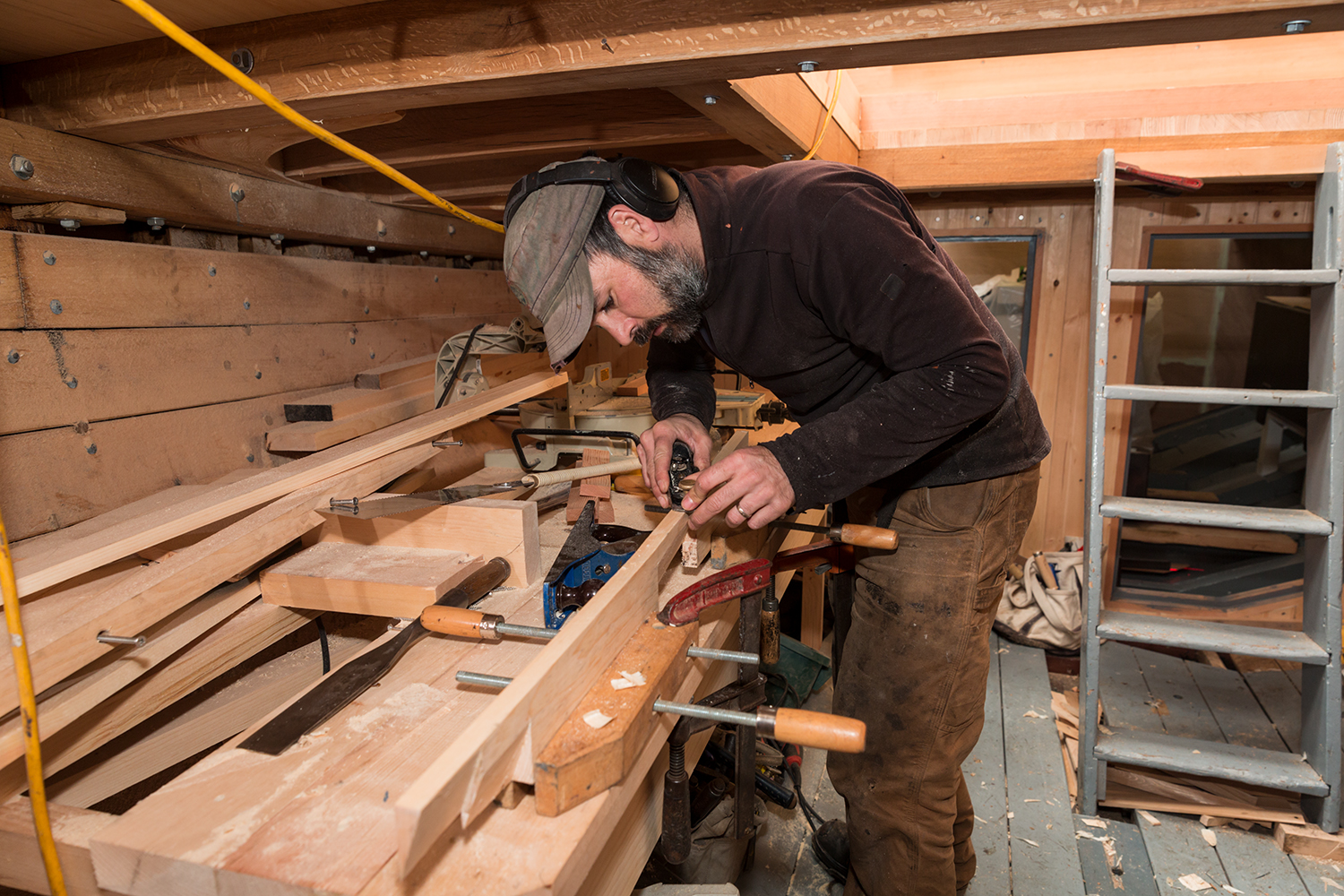 Ryan Graham down below working on the cabin sole. 