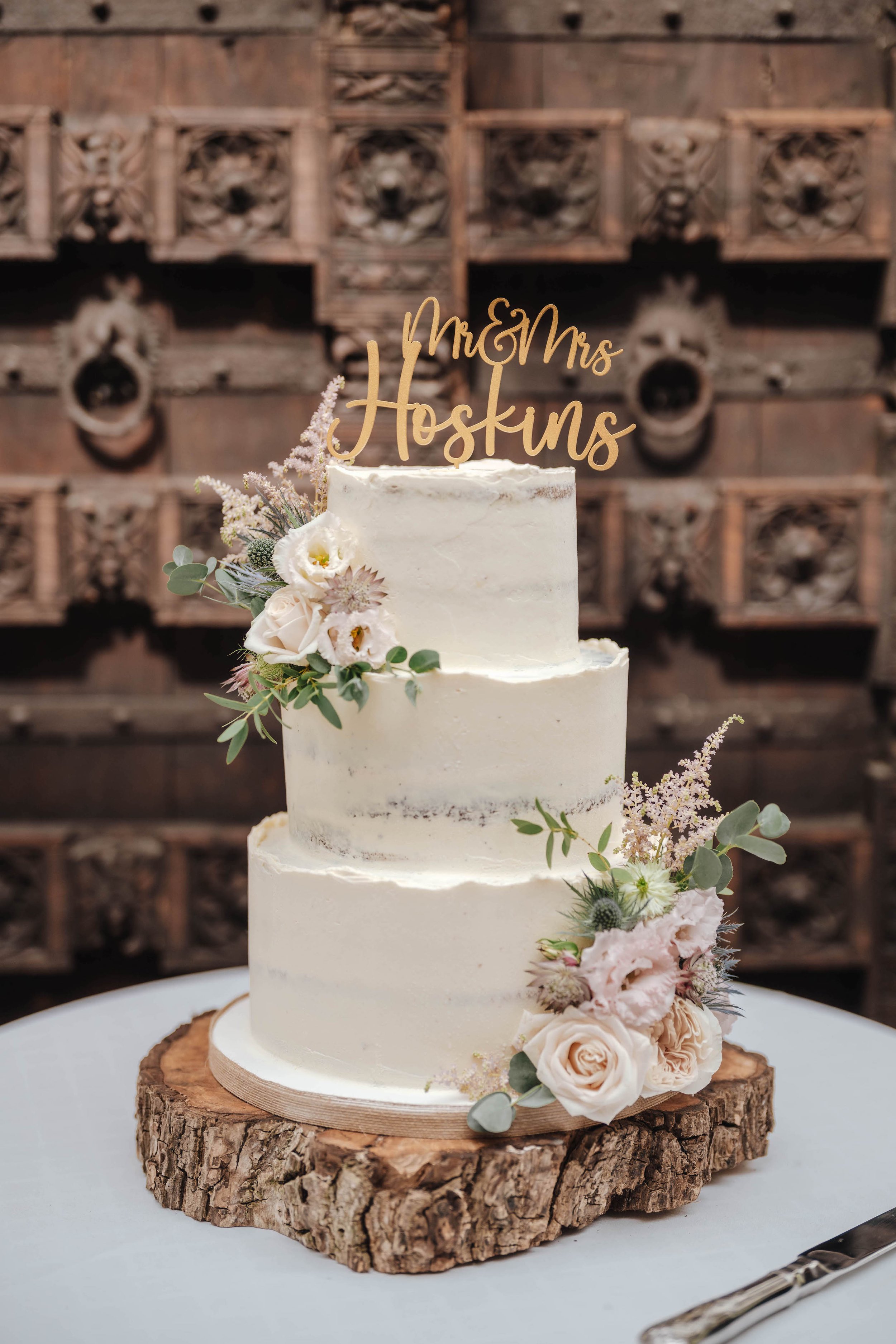 Blush flower semi-naked wedding cake