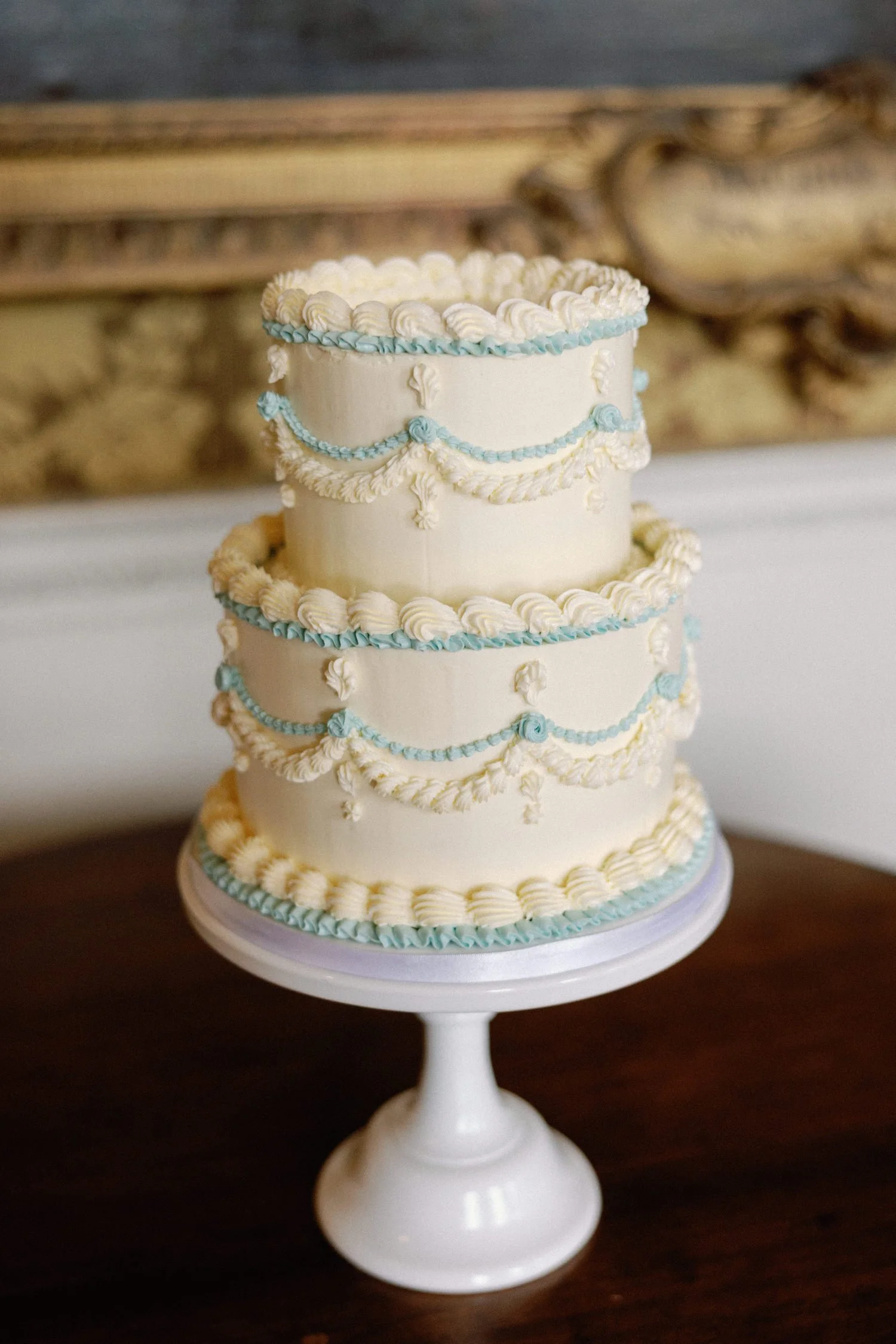2-tier white and blue Lambeth wedding cake