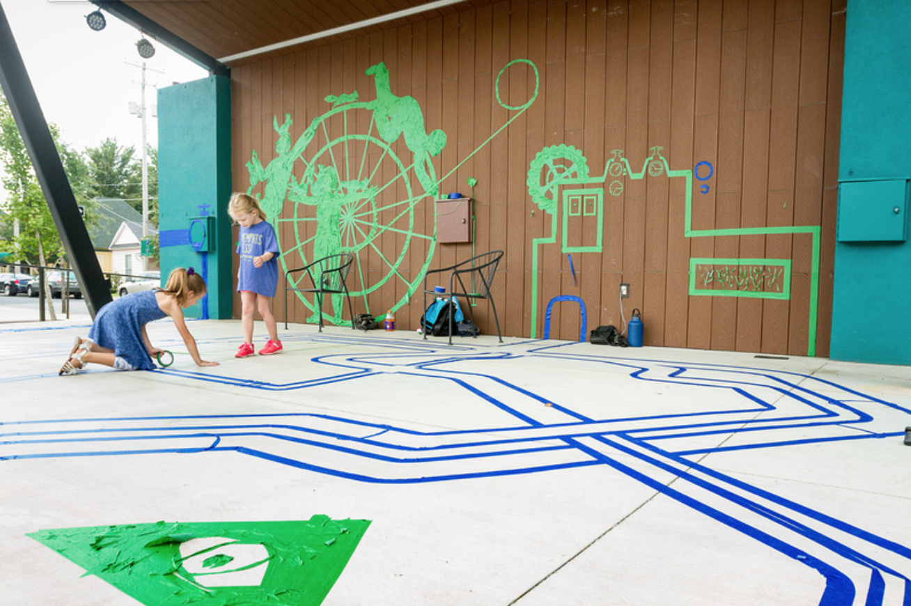 The international Tape Art Crew comes to Overton Square in conjunction with Brooks Museum, to the delight of young visitors