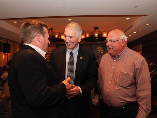 Caddo Parish cattleman Marty Wooldridge visits with Congressman Ralph Abraham, R-Alto, and Louisiana Farm Bureau President Ronnie Anderson. 