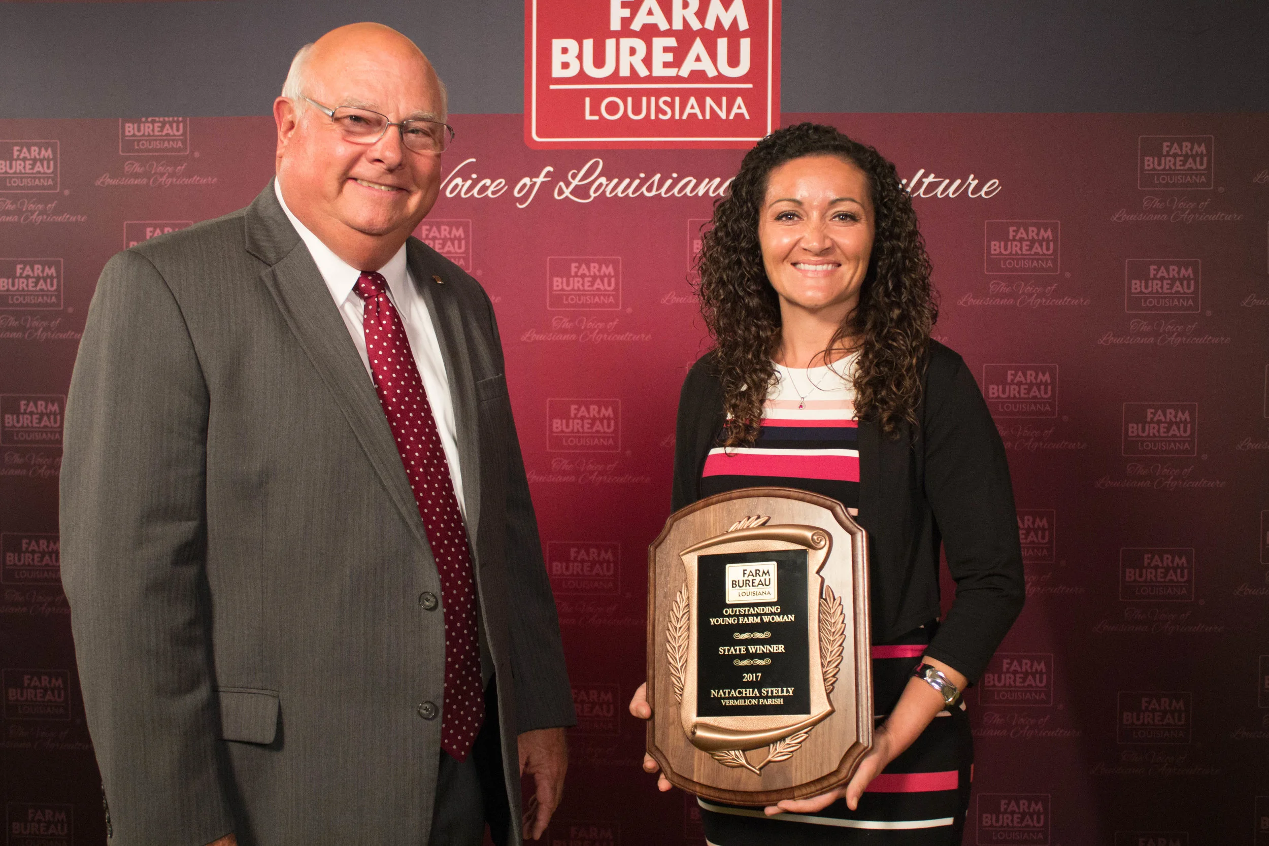 Louisiana Farm Bureau President Ronnie Anderson presented Acadiana farmer Natachia Stelly with the Louisiana Outstanding Young Farm Woman award at the Farm Bureau Convention in New Orleans.