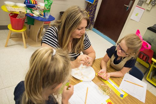 Parrino, the 2017 AITC Elementary Teacher of the Year, has her students explore the insides of a seed, to learn where their food comes from. Photo by Monica Velasquez. 