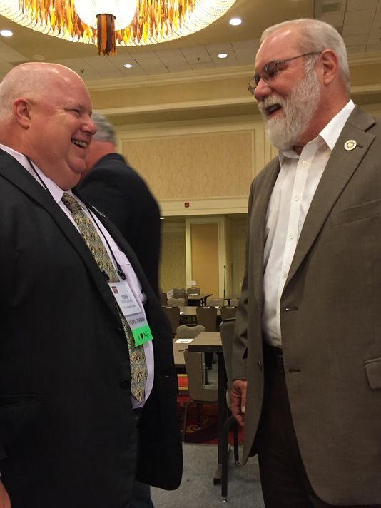 Republican Louisiana Agriculture Commissioner Mike Strain and state Sen. Bret Allain, R-Franklin, spoke to each other before speaking to the crowd this week at the Louisiana Farm Bureau Convention in New Orleans.(Photo: Greg Hilburn/USA Today Network)
