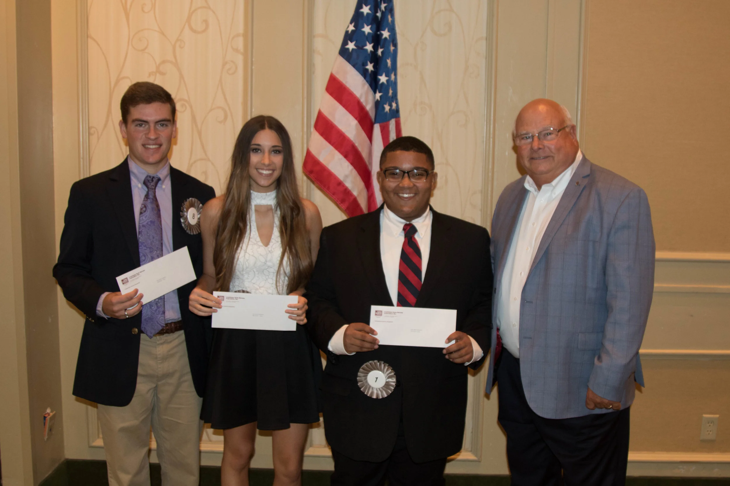 2017 Talk Meet winners pictured left to right: Wesley Adolph, Assumption Parish, second place, Bailey Nelson, Calcasieu Parish, third place, William Gaspard, Avoyelles Parish, first place and Ronnie Anderson, Louisiana Farm Bureau President. Photo by Karl Wiggers.