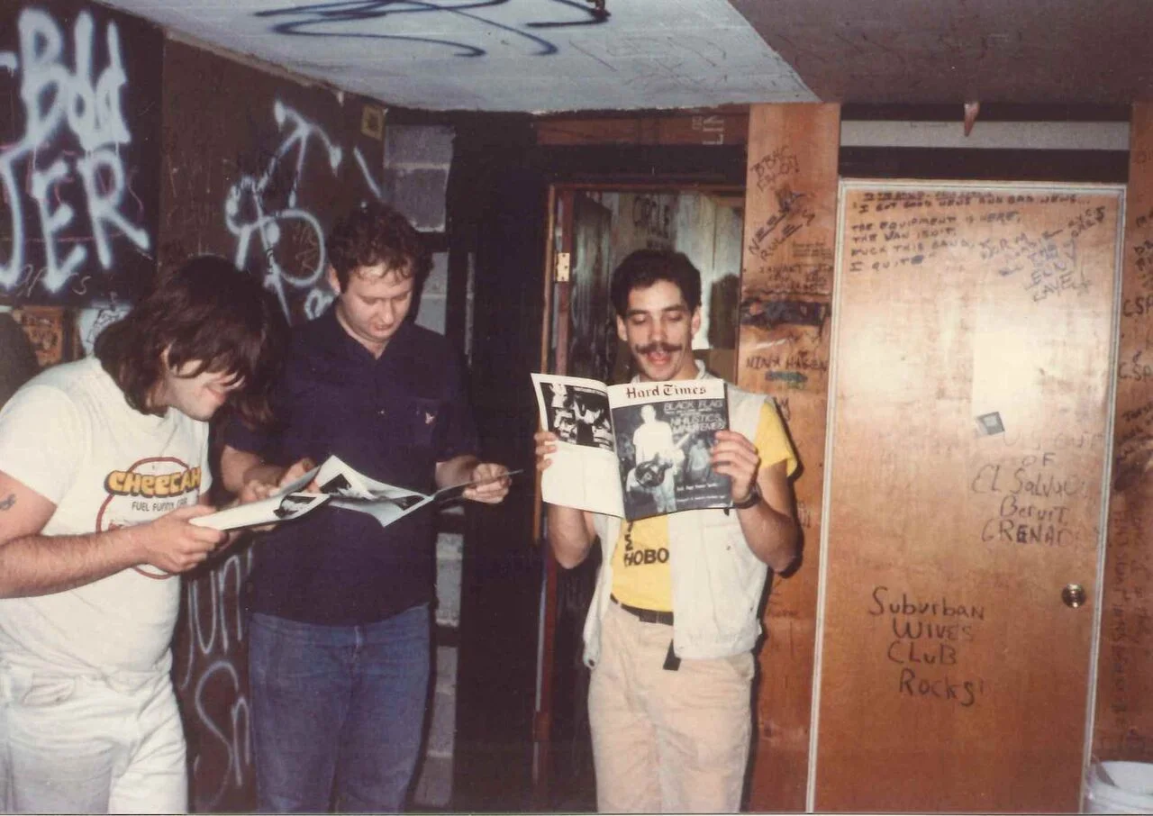 The Husker Du lads enjoying a fine issue of Hard Times backstage at City Gardens. Photo by Ron Gregorio