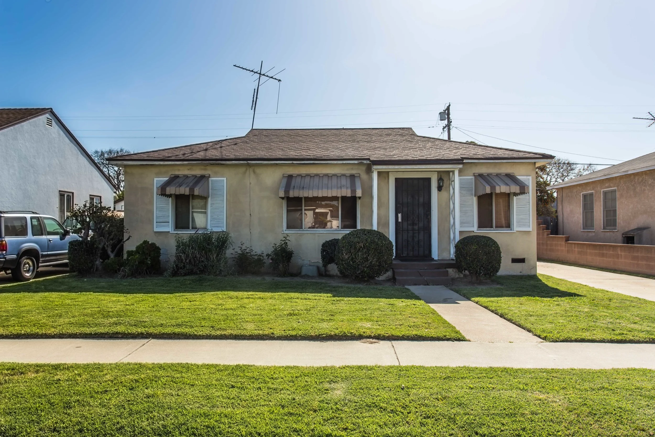 So much potential! This home has a great layout, original wood floors, large kitchen, a spacious backyard with fruit trees and a block wall fence, and a detached two car garage with a long driveway – plenty of parking! Ready for a new owner to make their own.